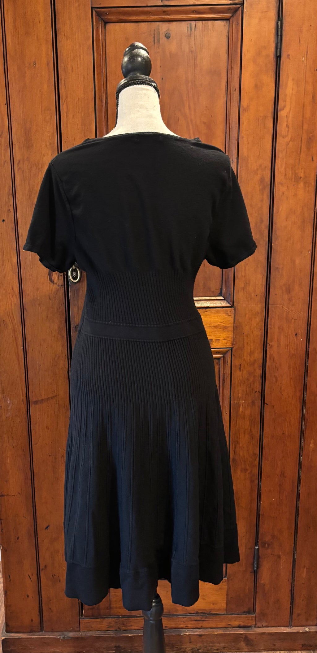 Eva Mendes black short sleeve fit and flare dress back view pre-loved dresses like new Sassy and Chic