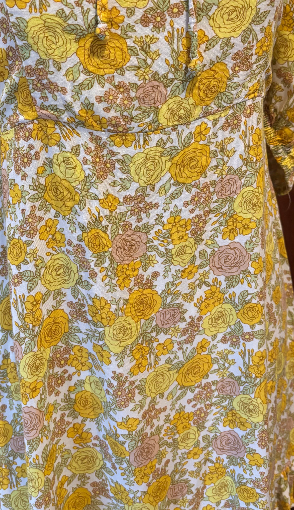 Faithfull yellow floral dress detail close up flirty ruffle hem cheerful floral print Sassy and Chic