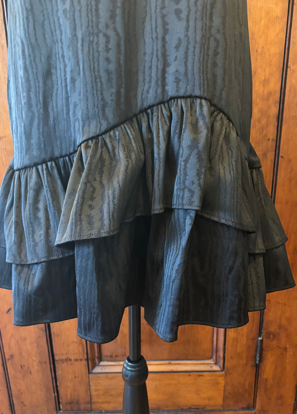 Trina Turk black sleeveless dress detail close up pretty ruffled hemline like new Sassy and Chic