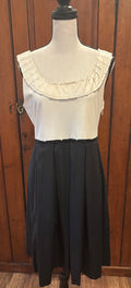 Elie Tahari cream black pleated dress front view ruffle detail pockets pre-loved designer cocktail dresses Sassy and Chic