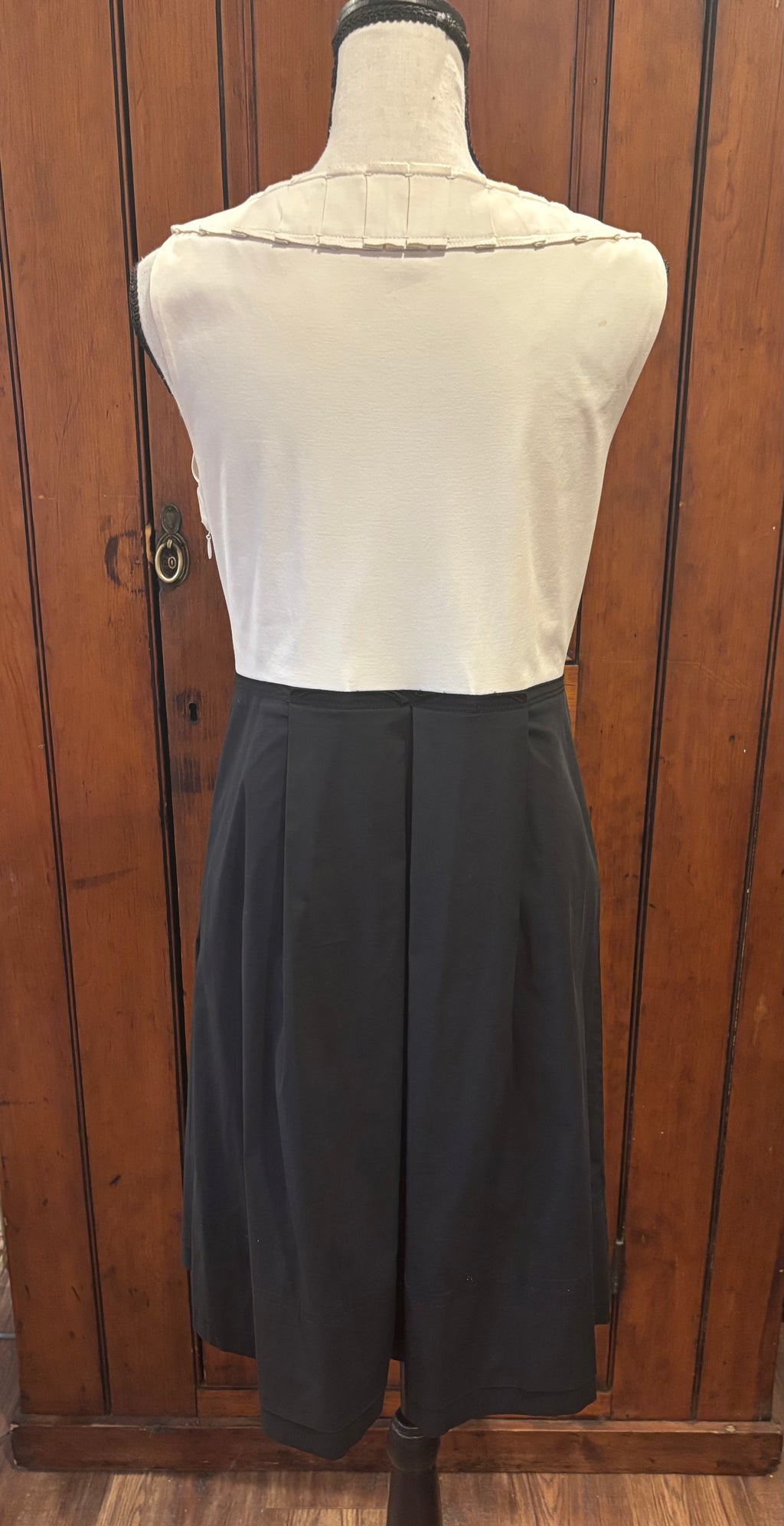 Elie Tahari cream black pleated dress back view tiny spot as shown pre-loved cocktail dresses Sassy and Chic