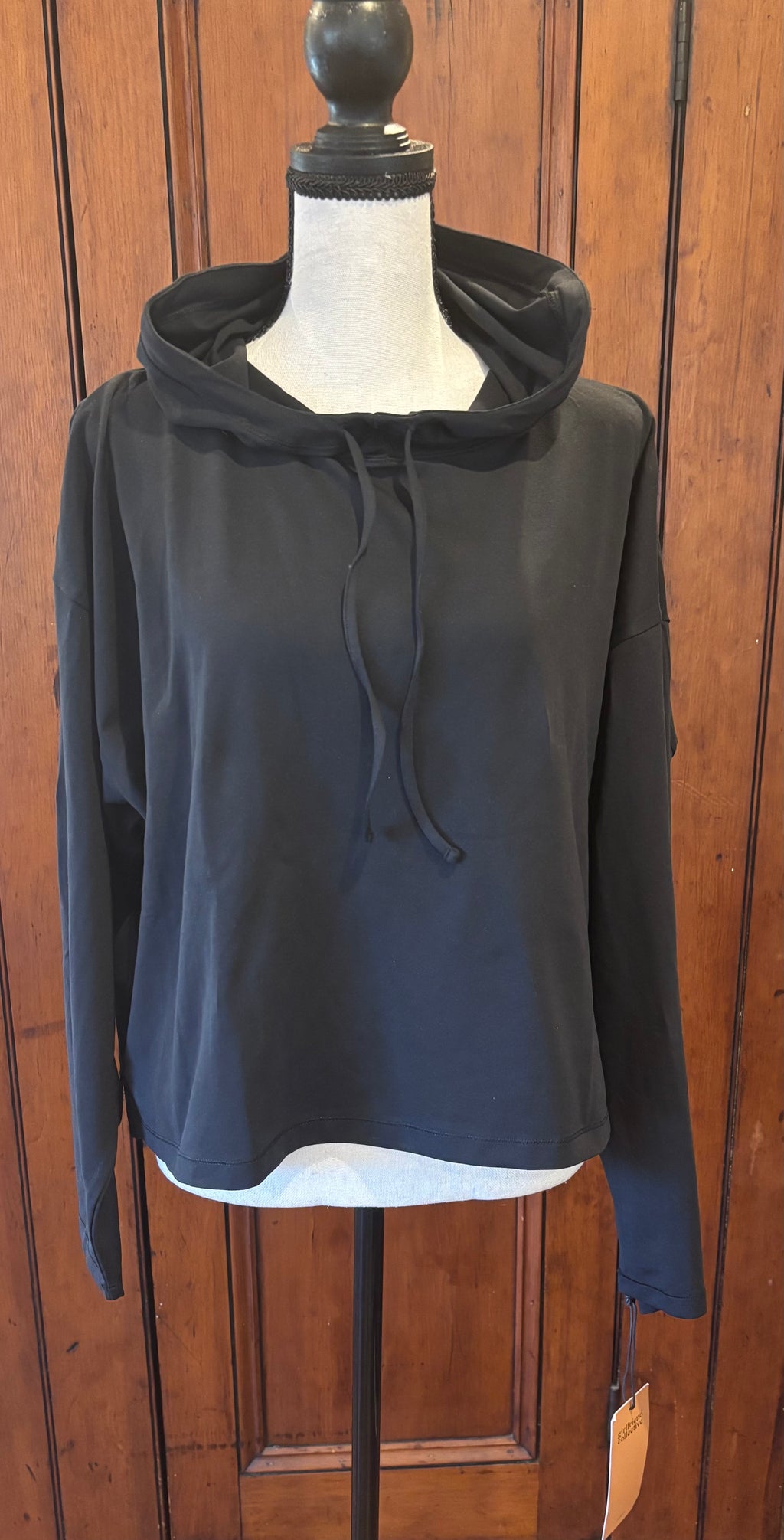 Girlfriend Collective black pullover hoodie front view relaxed silhouette pre-loved sweatshirts Sassy and Chic