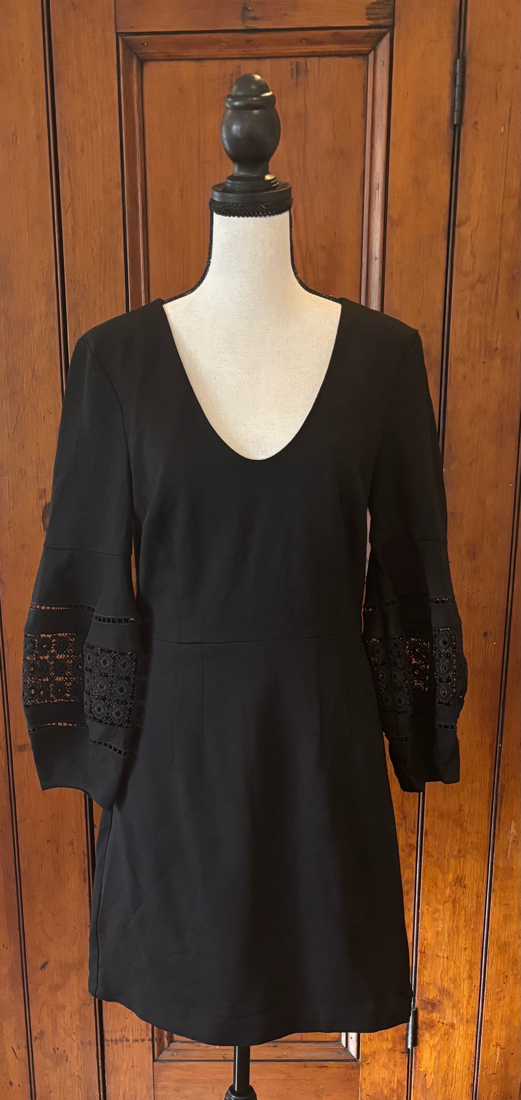 Trina Turk black deep V-neck dress front view 3/4 sleeves pre-loved designer dresses like new Sassy and Chic