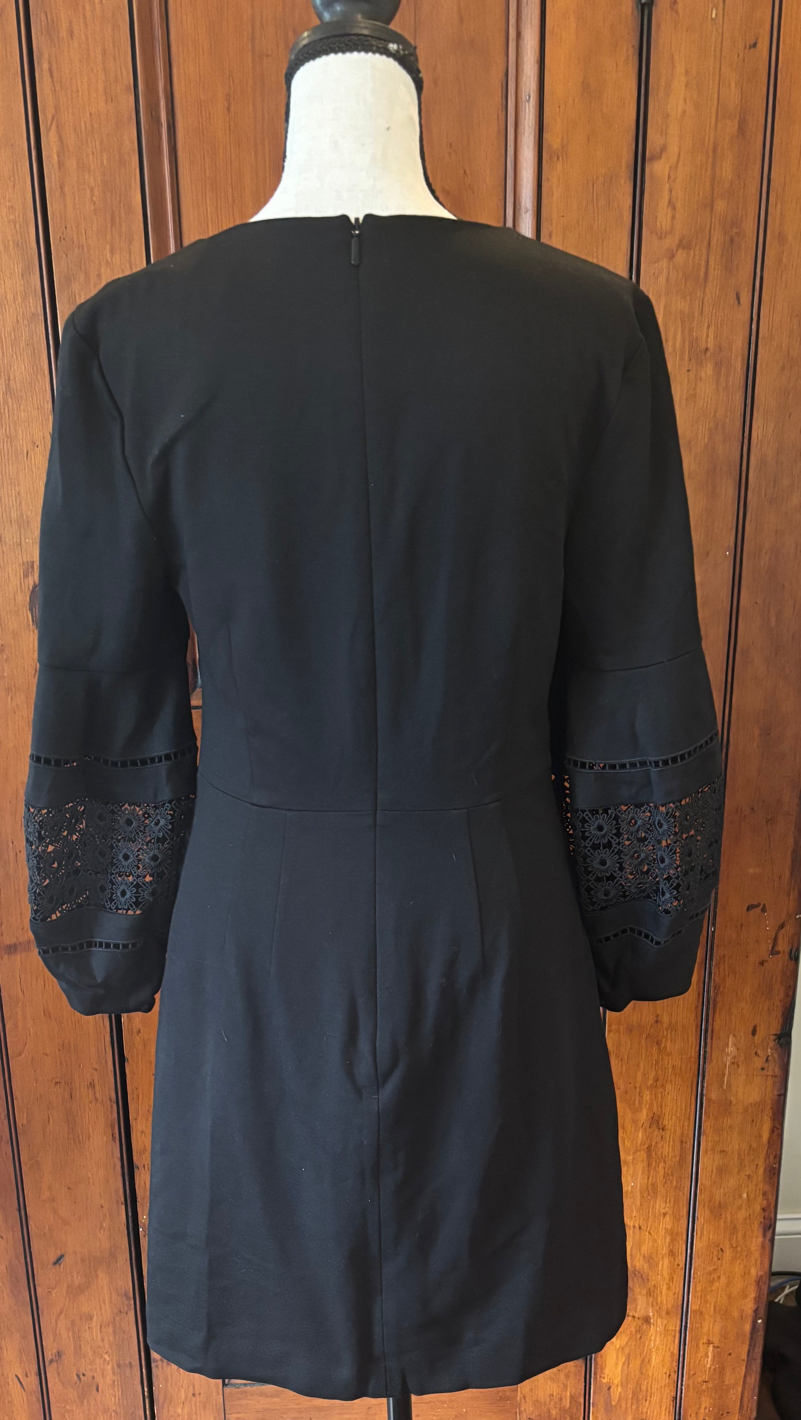 Trina Turk black deep V-neck dress back view pre-loved designer dresses like new Sassy and Chic
