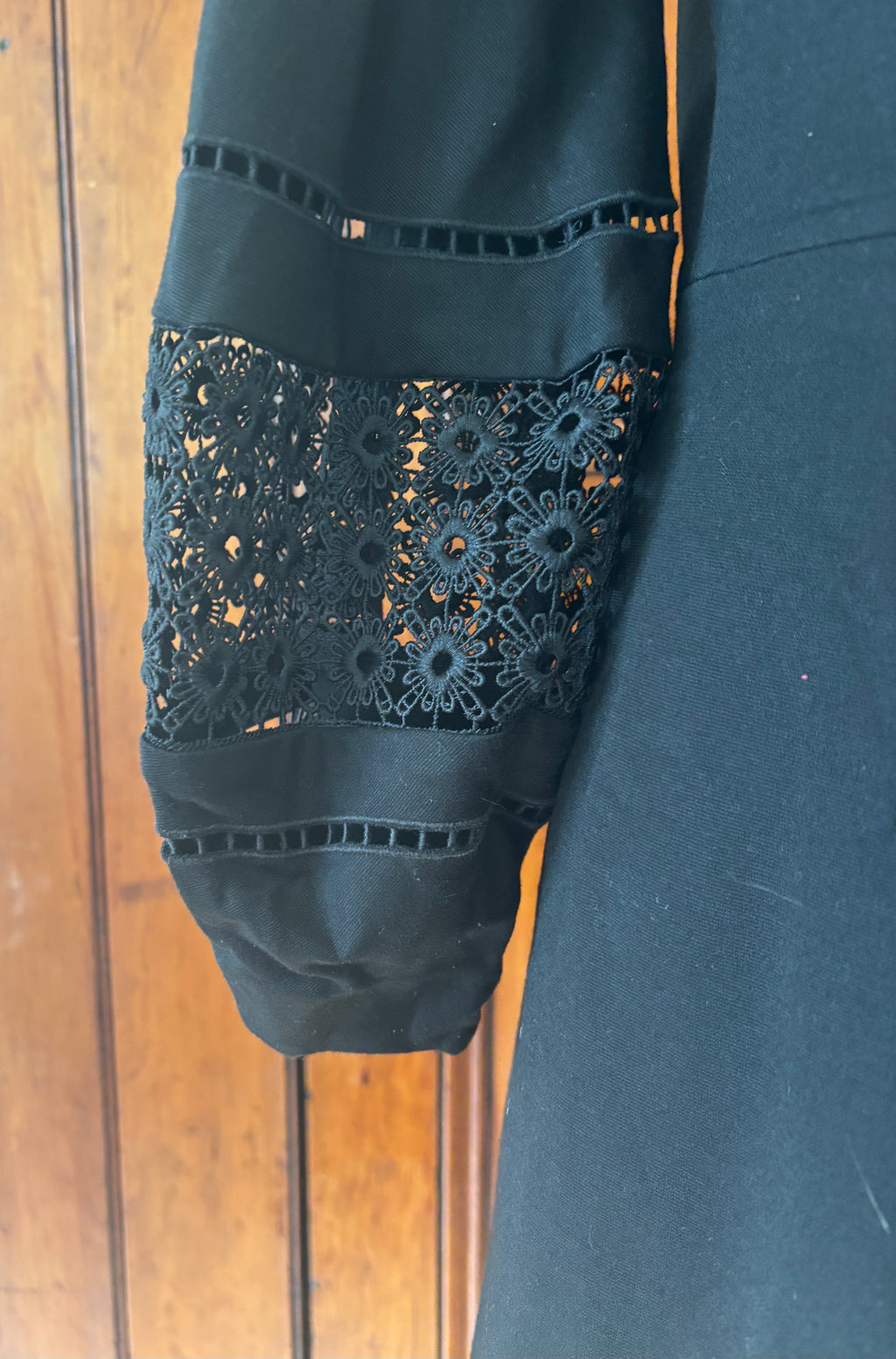 Trina Turk black deep V-neck dress detail close up dramatic V-neckline flowy fabric like new Sassy and Chic