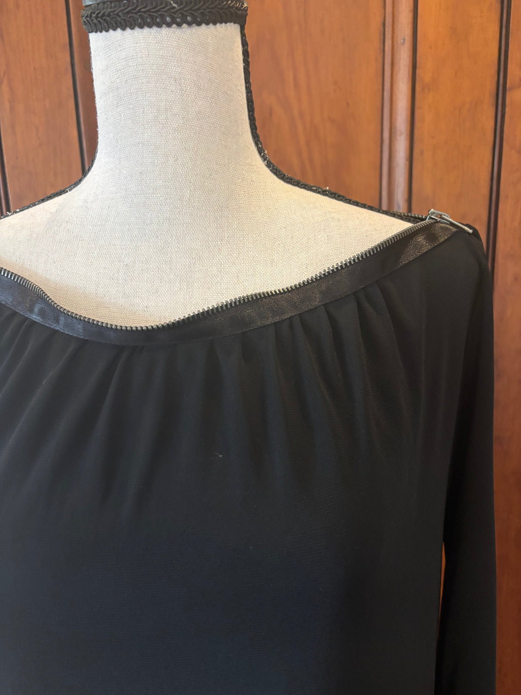 DVF black long sleeve sheath dress detail close up bold zipper neckline fashion forward edge Sassy and Chic