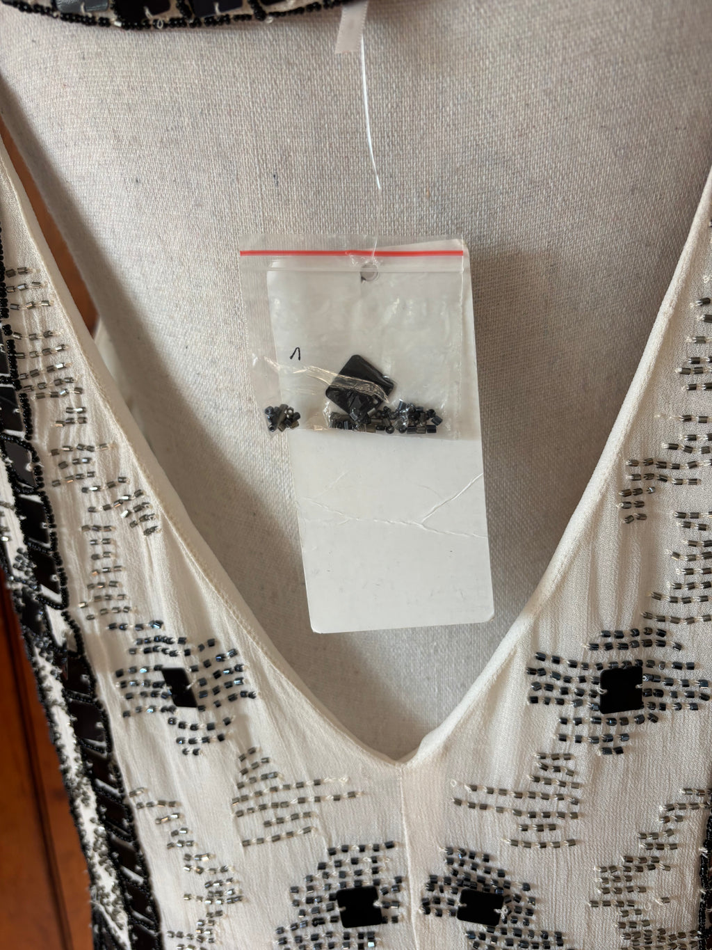 Free People off white beaded mini dress detail close up stunning beaded accents spare beads Sassy and Chic