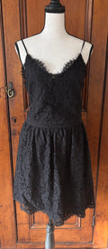 Joi black lace spaghetti strap mini dress front view flirty mini silhouette thrifted cocktail dresses Sassy and Chic