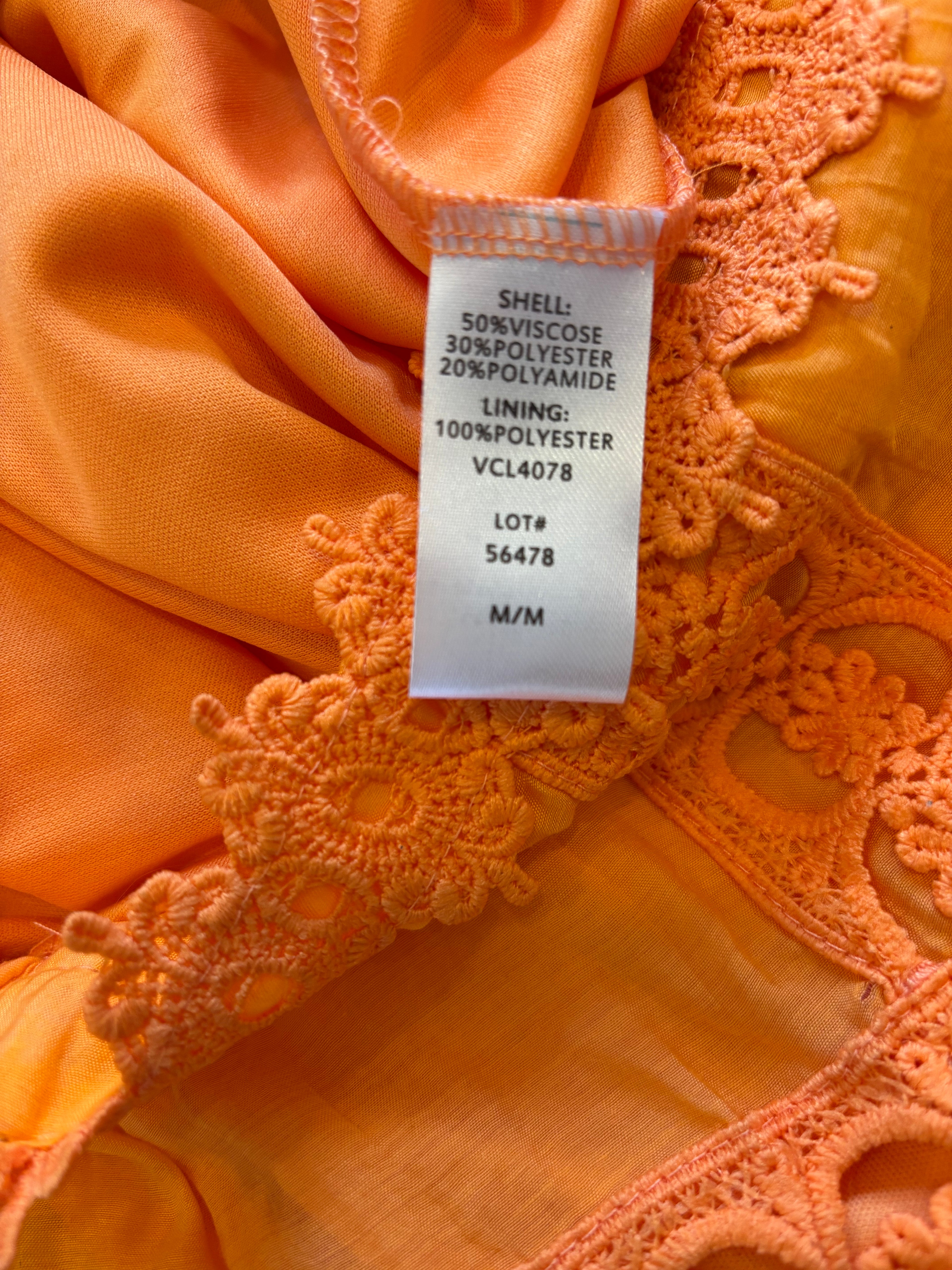 Etiquette vibrant orange mini skirt front view flirty silhouette like new Sassy and Chic