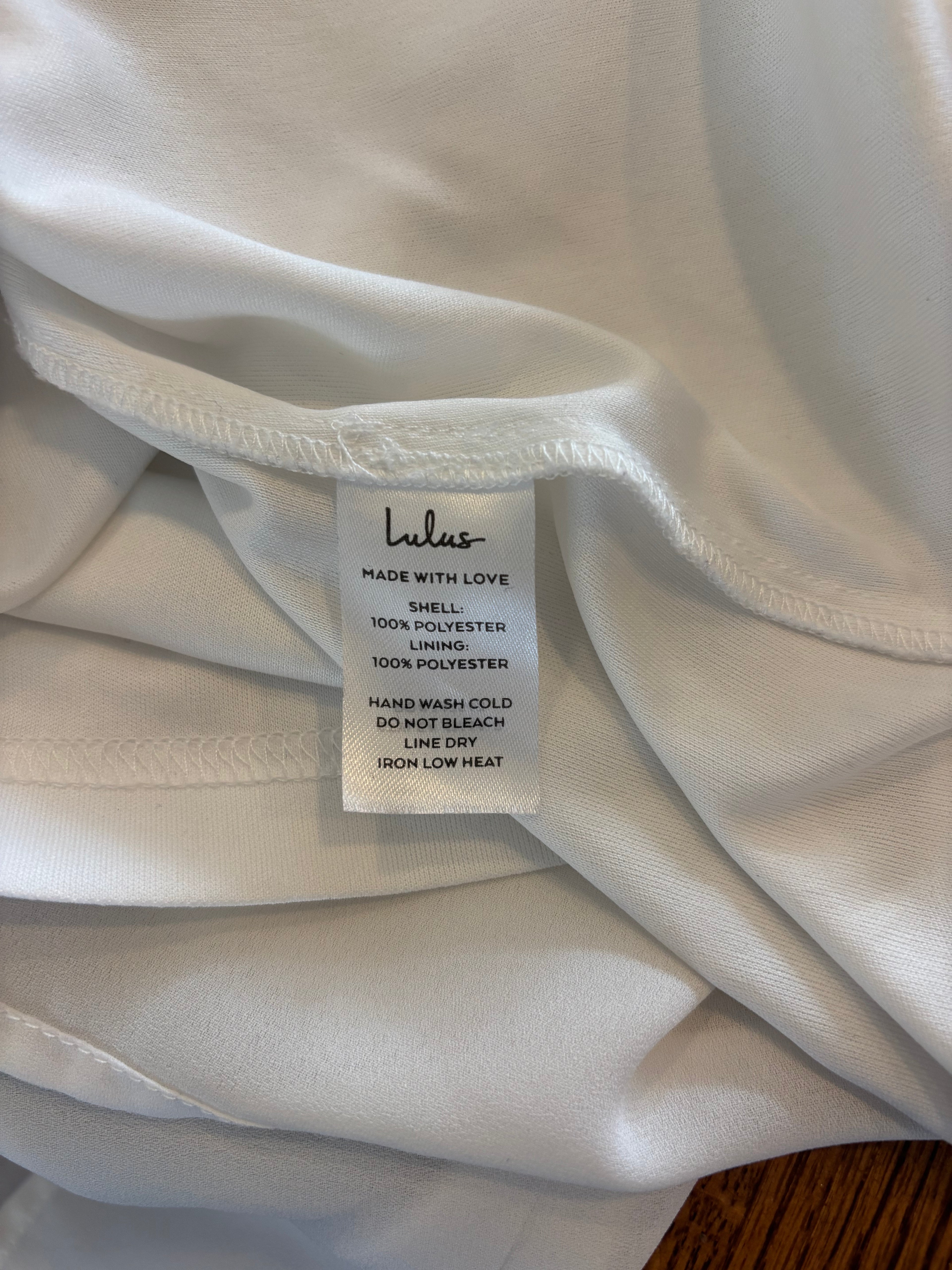 Lulus white long sleeve V-neck mini dress detail close up tiny spot on backside as shown Sassy and Chic