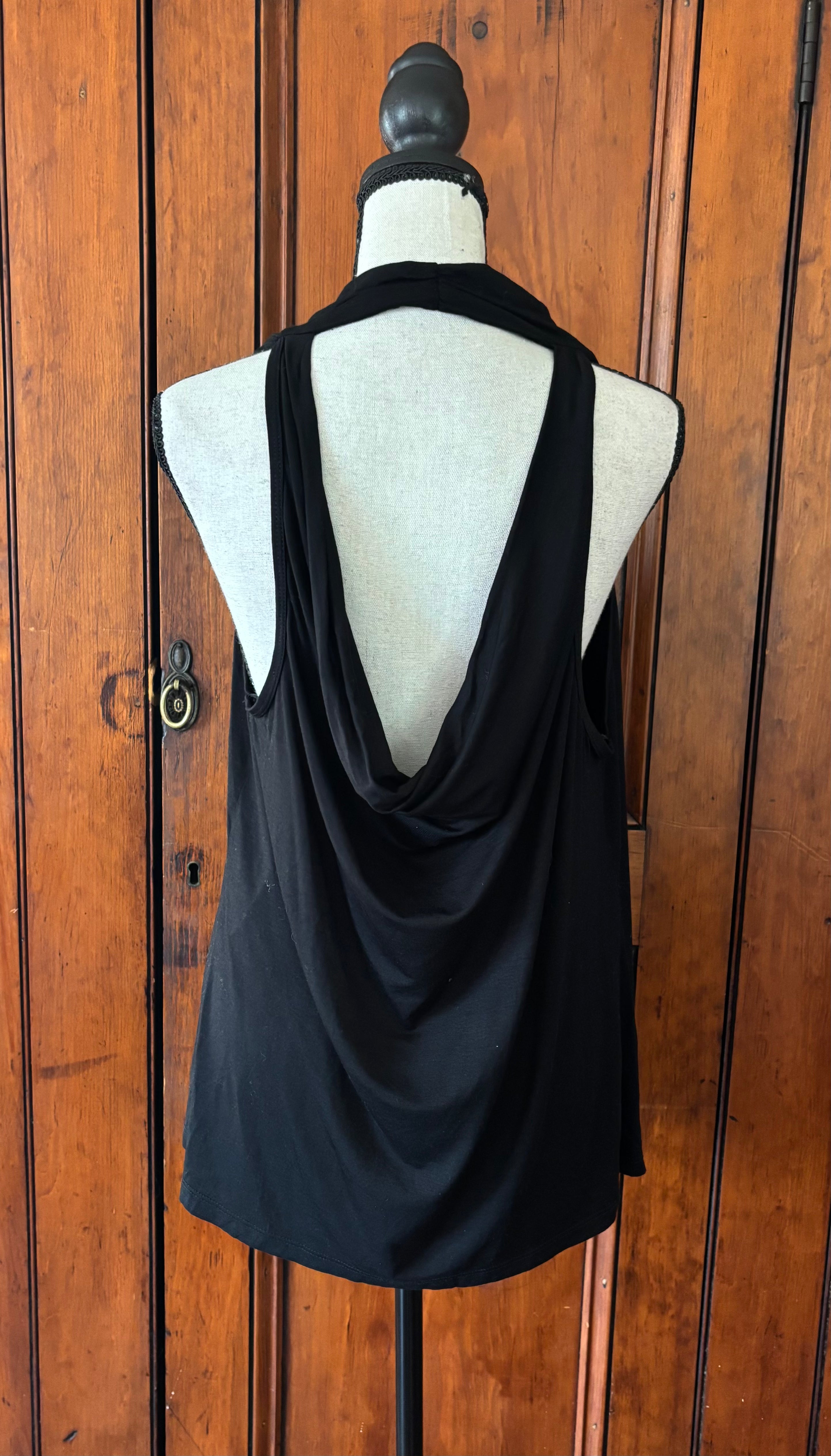 Pre-owned tops and blouses. Trina Turk black sleeveless top back view sophisticated low back detail like new Sassy and Chic