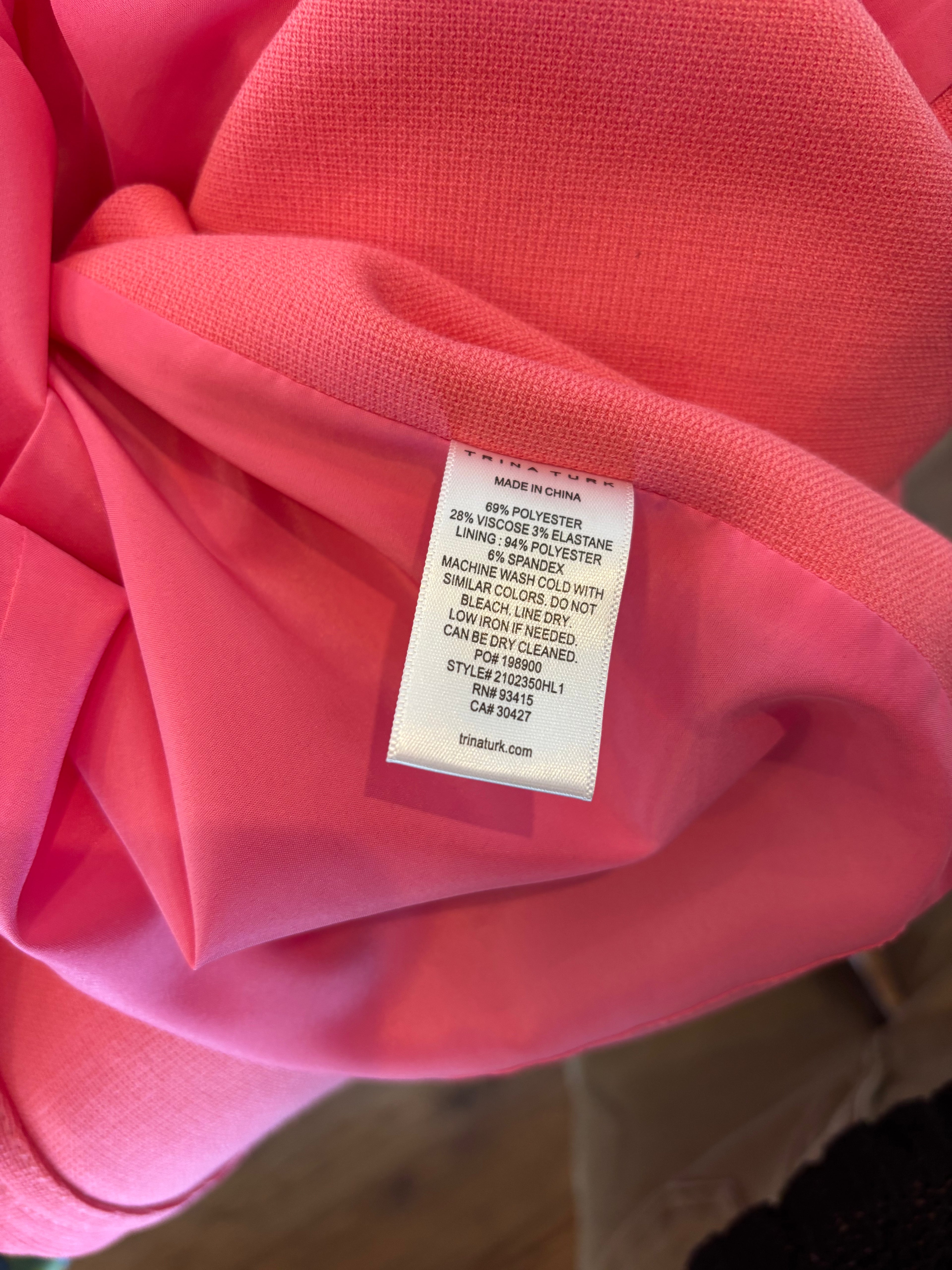 Trina Turk pink sleeveless midi dress detail close up pretty pink hue round neckline like new Sassy and Chic