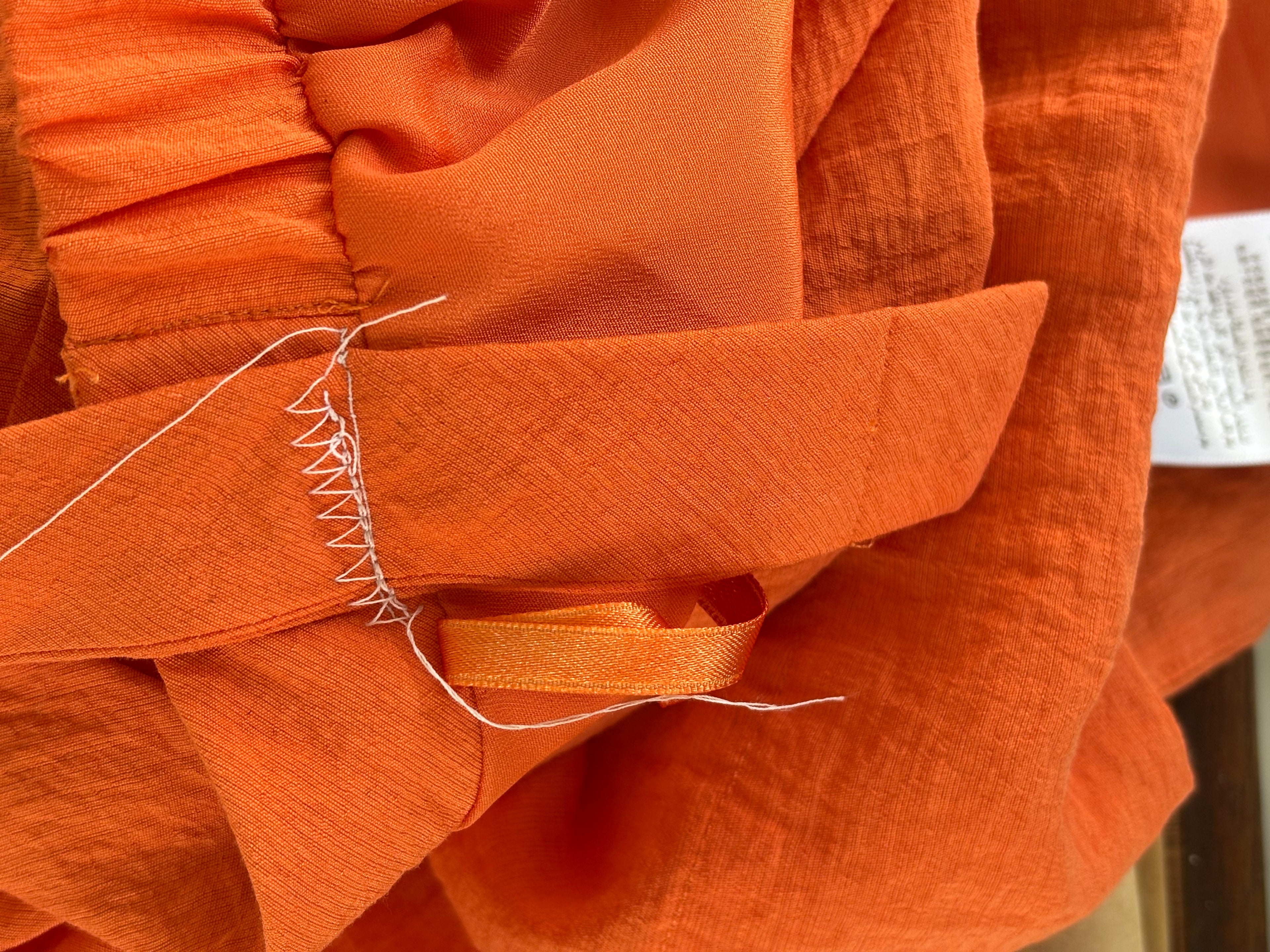 BCBG orange sleeveless mini dress detail close up strap adjustment as shown like new Sassy and Chic