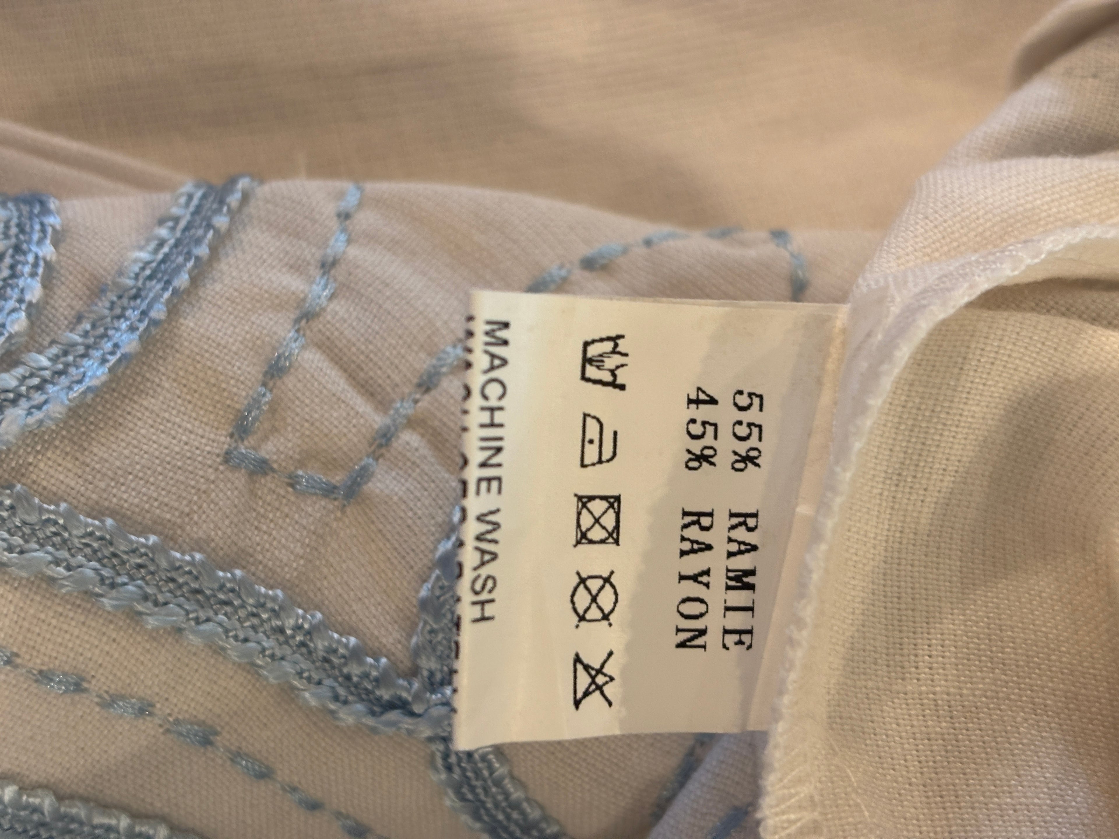 Fabric content label showing 55% Ramie 45% Rayon for Les Canebiers white embroidered tunic dress