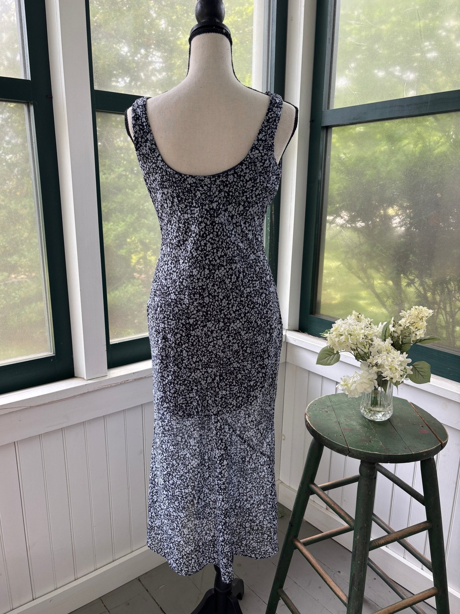 Abercrombie & Fitch navy floral midi dress, back view showing low scoop and fluid skirt