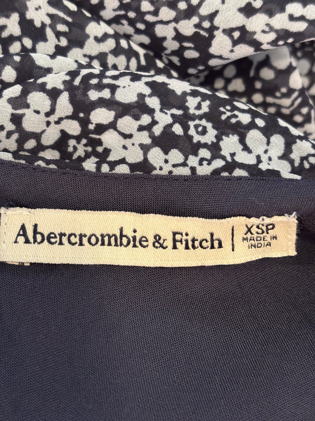 Abercrombie & Fitch brand label showing size XSP, made in India