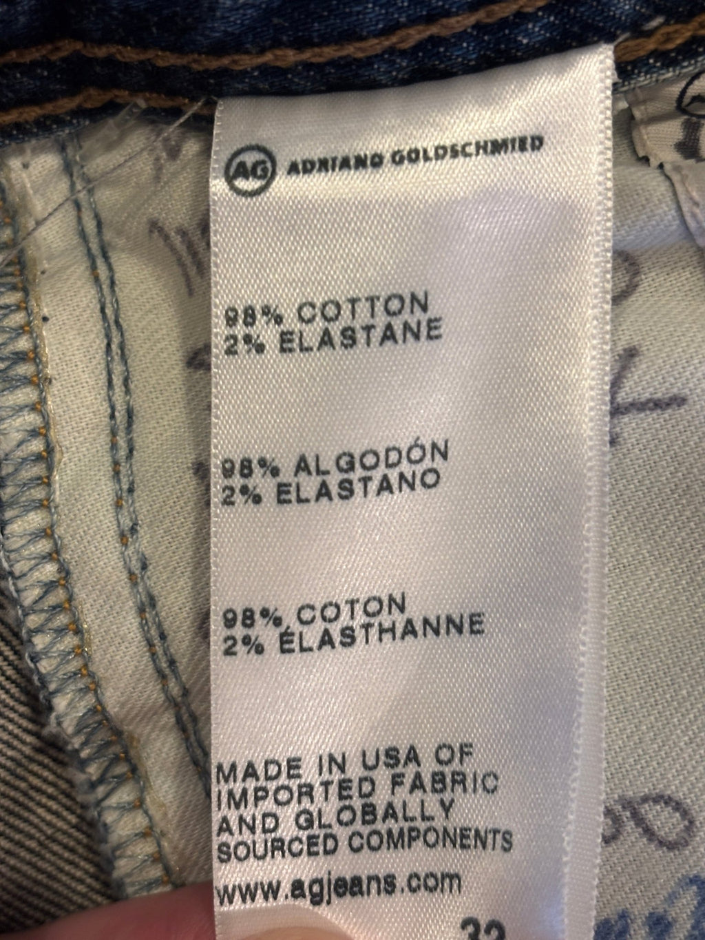 Fabric content label showing 98% cotton, 2% elastane, made in USA