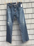 AG Adriano Goldschmied The Protégé straight leg jeans hanging on clothesline with tags