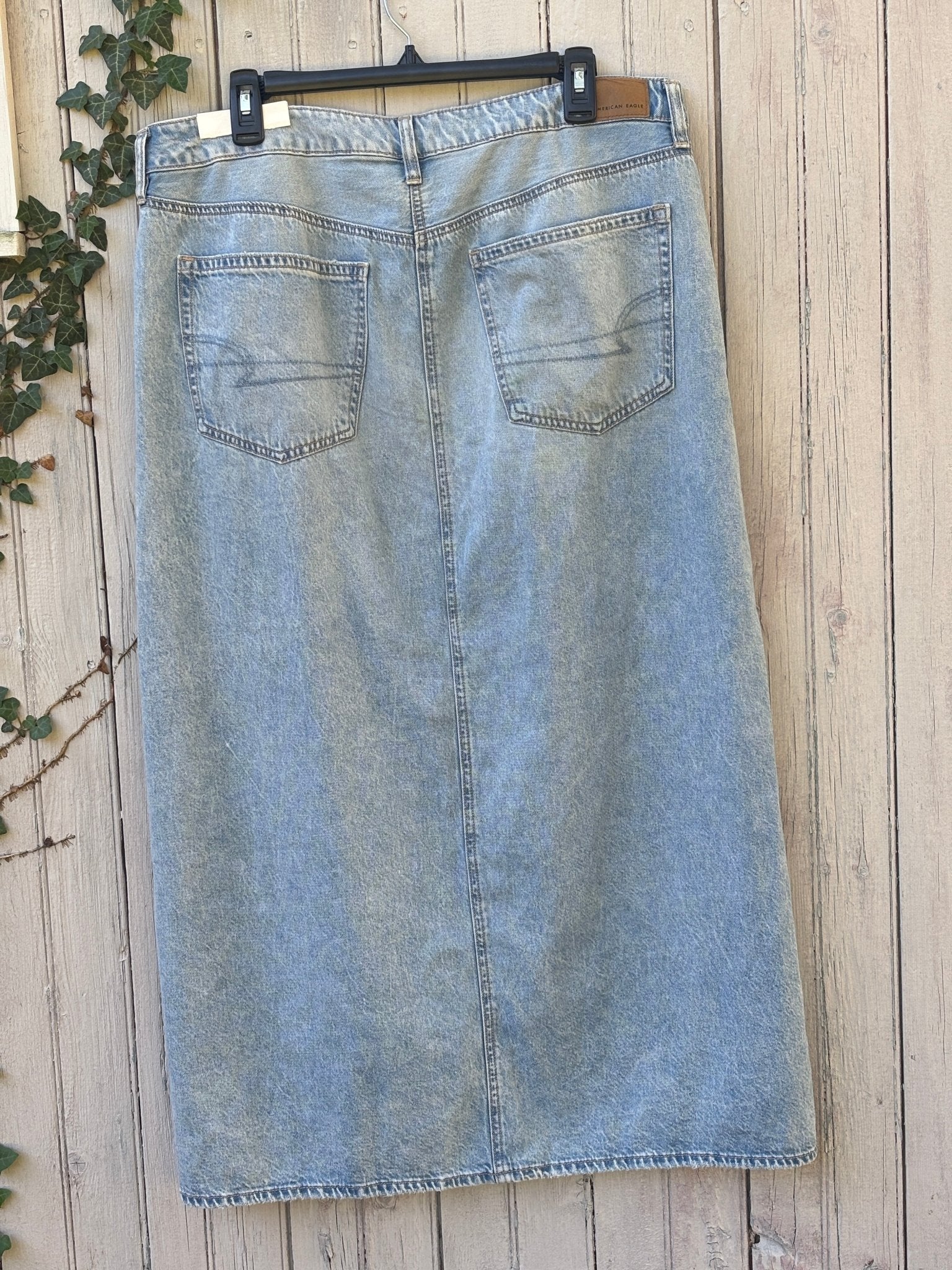 Full back view of American Eagle light wash denim maxi skirt showing back pockets