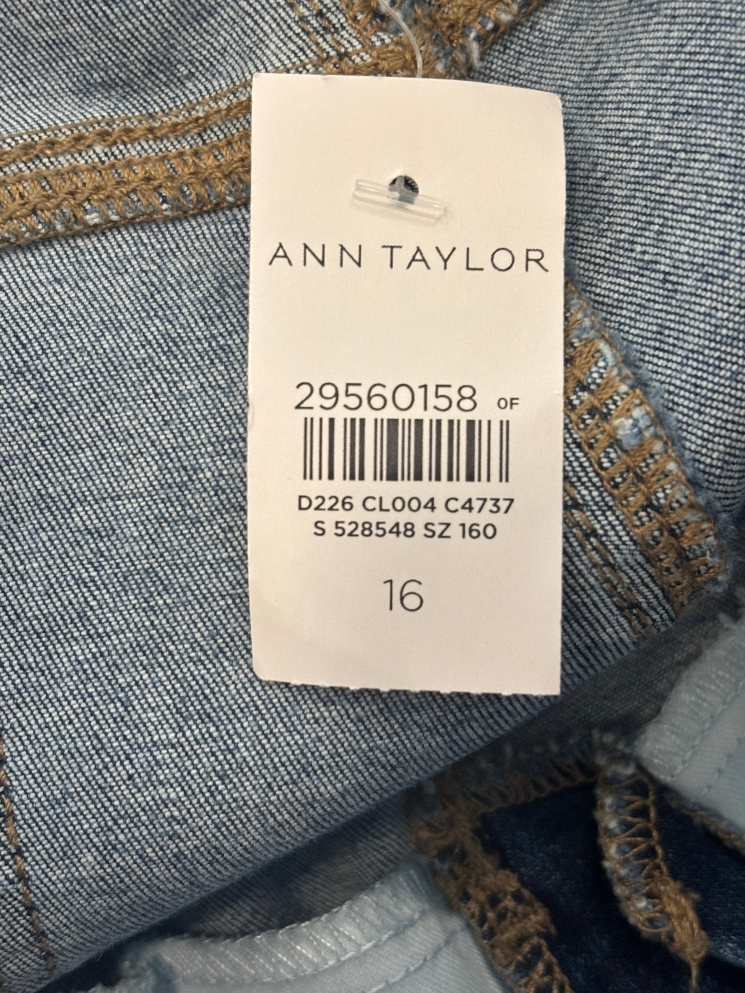 Ann Taylor brand hang tag showing size 16 on Kick Crop high rise medium wash jeans, NWT