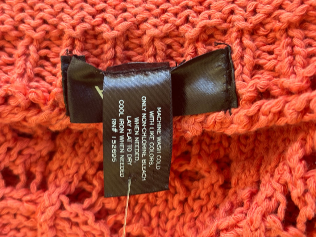 Care label showing machine wash cold, lay flat to dry instructions