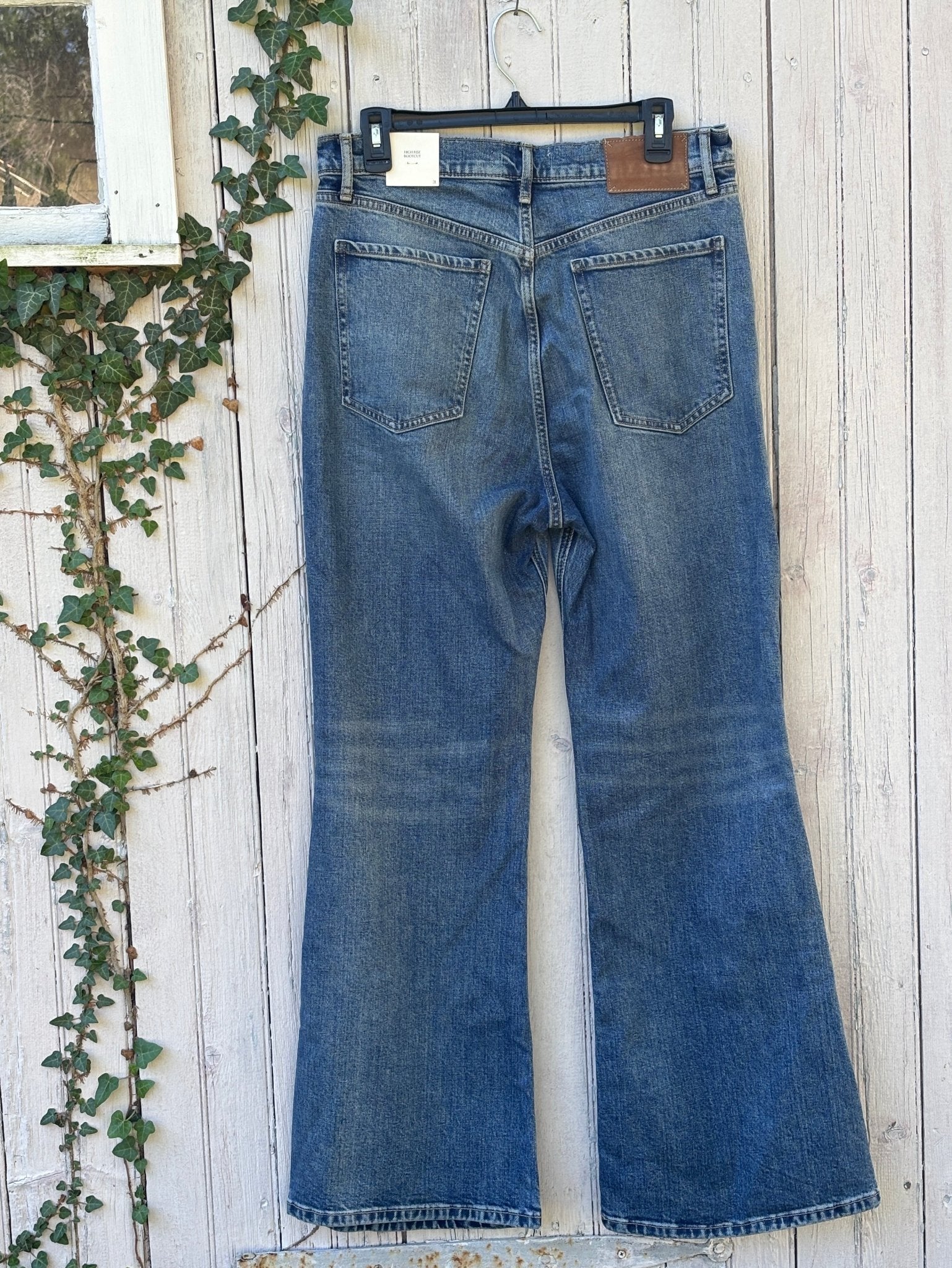 Full back view of Banana Republic high rise bootcut jeans showing leather patch and back pockets