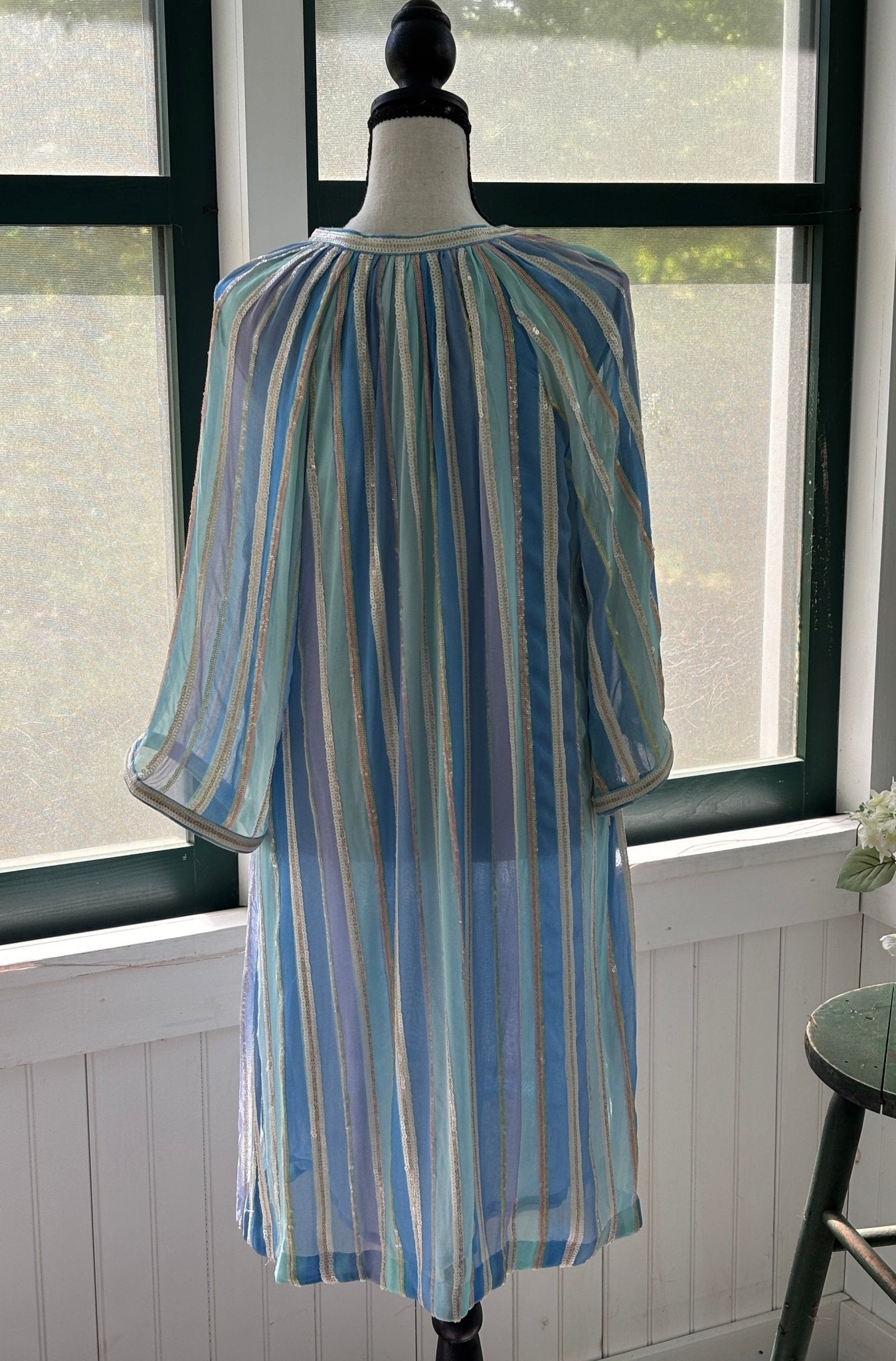 Bella Tu Petra tunic dress back view showing gathered yoke and flowing sequin stripe silhouette
