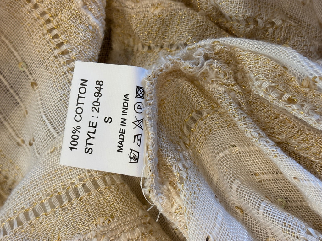 Care label showing 100% cotton fabric content and Made in India on Buby.S tunic