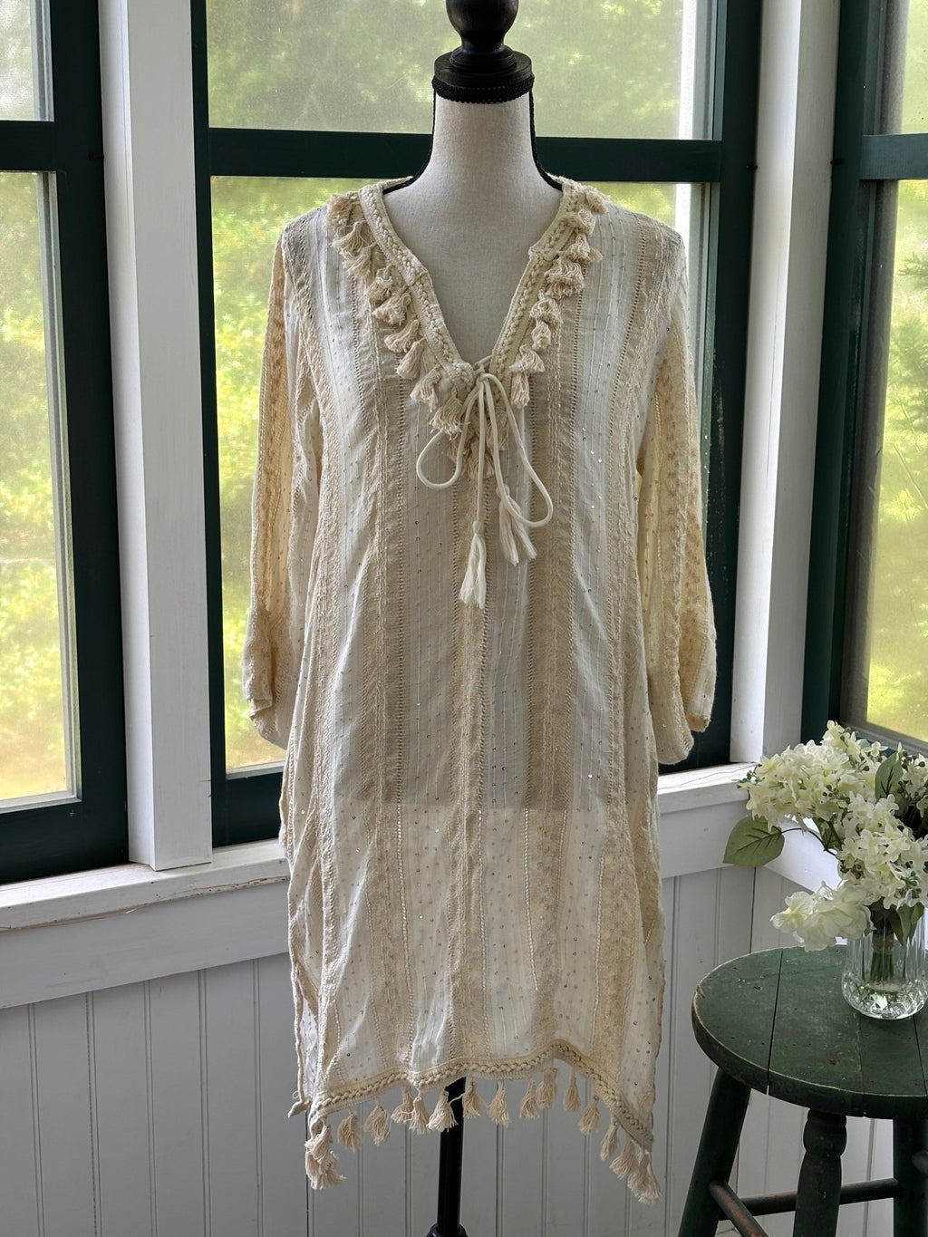 Buby.S Dreamy Woven Tassel Tunic front view in ivory cream on mannequin showing V-neckline tassel tie and full length, size Small NWT