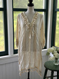 Buby.S Dreamy Woven Tassel Tunic front view in ivory cream on mannequin showing V-neckline tassel tie and full length, size Small NWT