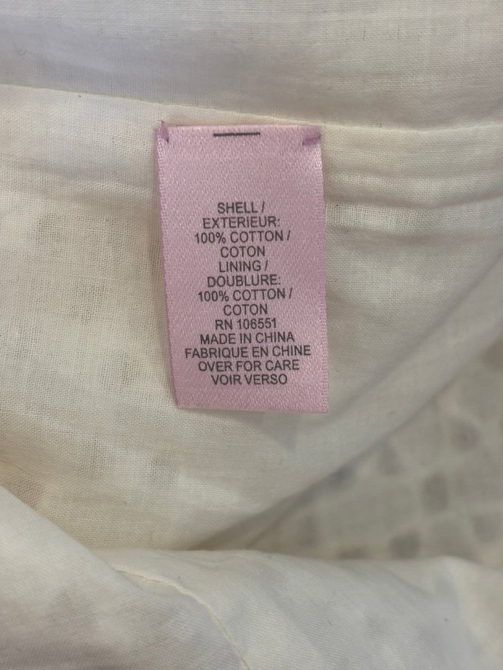 Fabric content label showing 100% cotton shell and lining for Calypso St. Barth dress