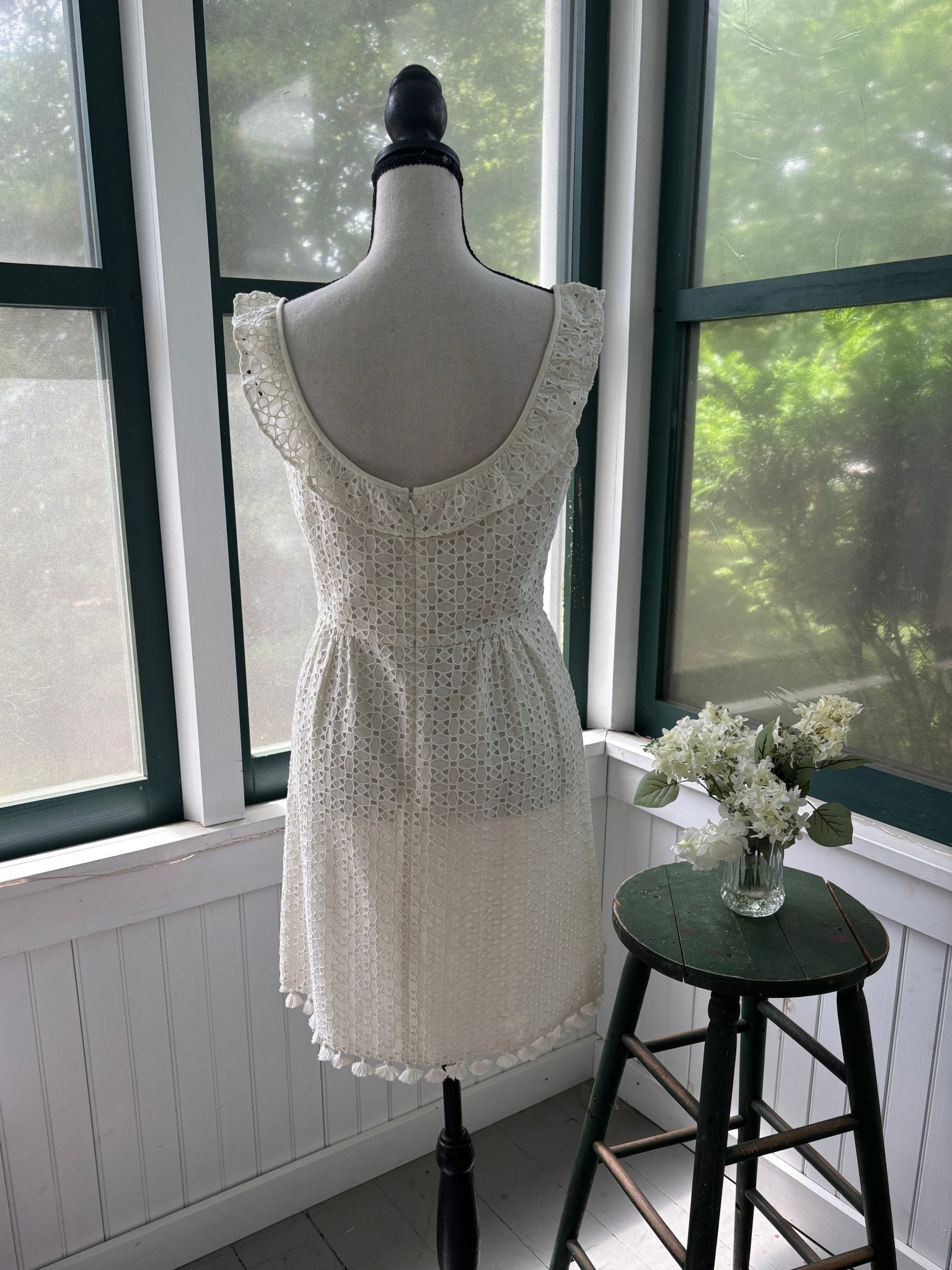Calypso St. Barth white crochet dress, back view showing A-line silhouette