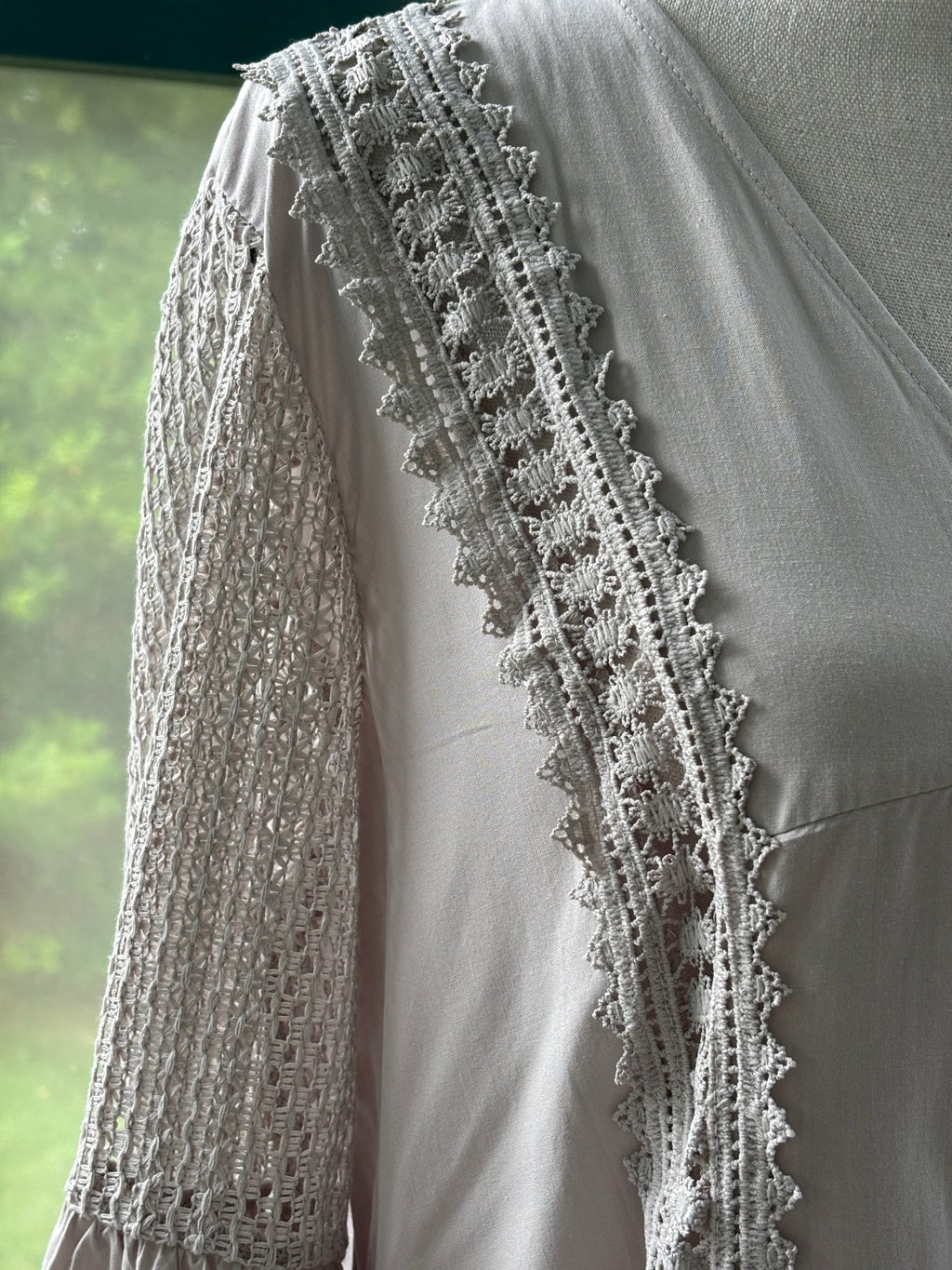 Close-up of ruffle bell cuff and lace trim side detail on Cupshe blush lace mini dress