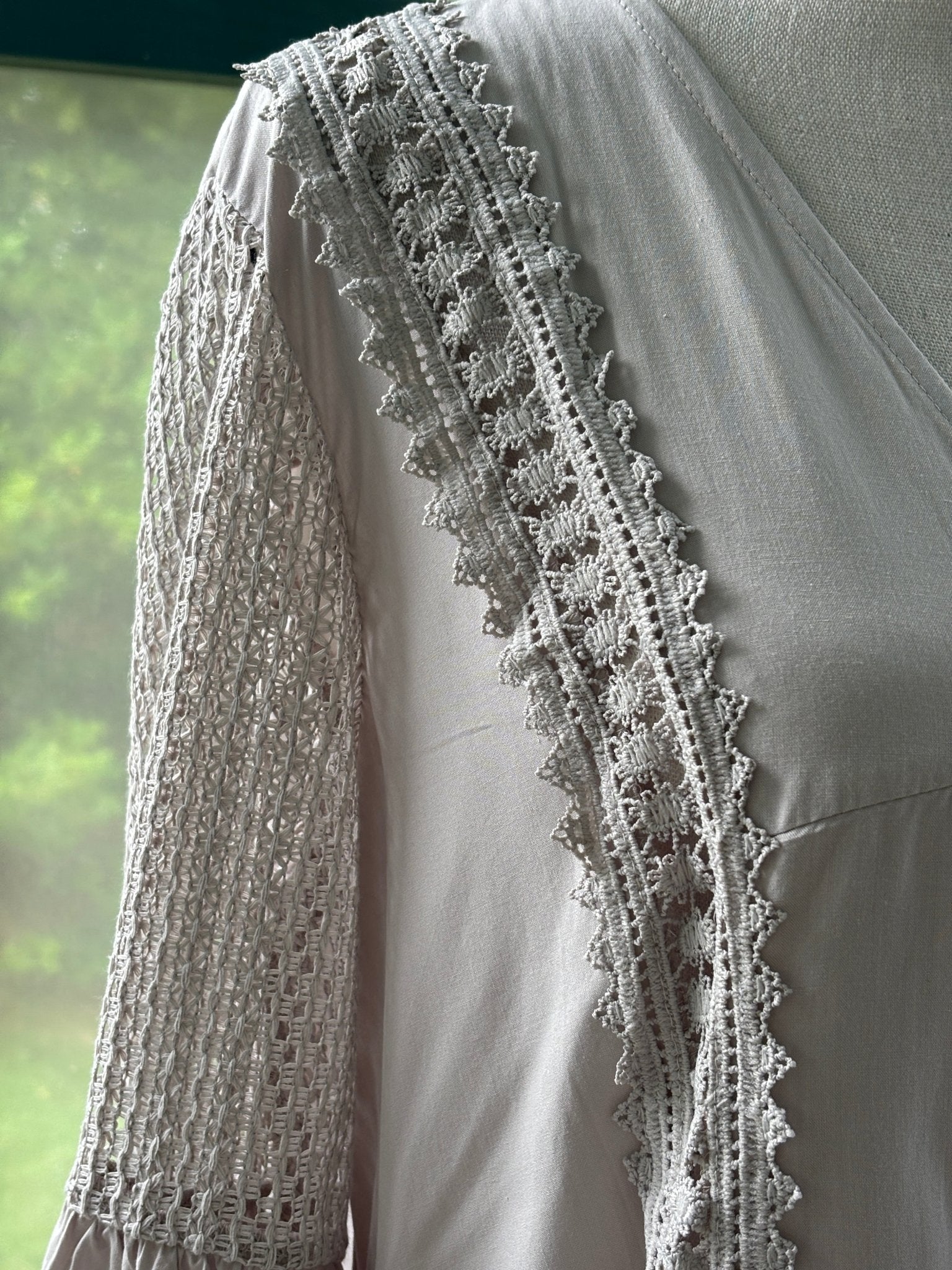 Close-up of ruffle bell cuff and lace trim side detail on Cupshe blush lace mini dress