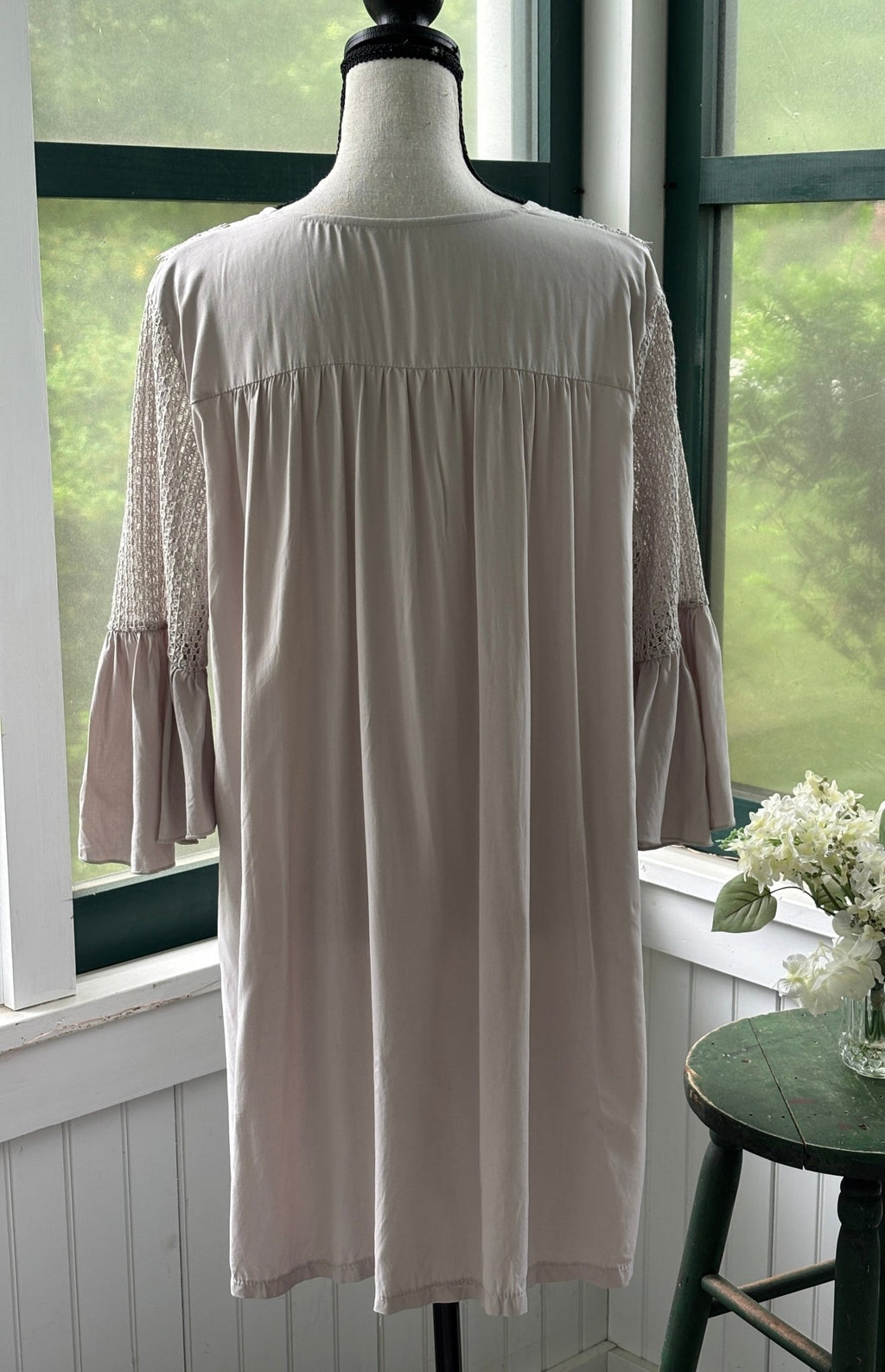 Back view of Cupshe blush lace trim mini dress showing fully gathered silhouette and crochet lace sleeves