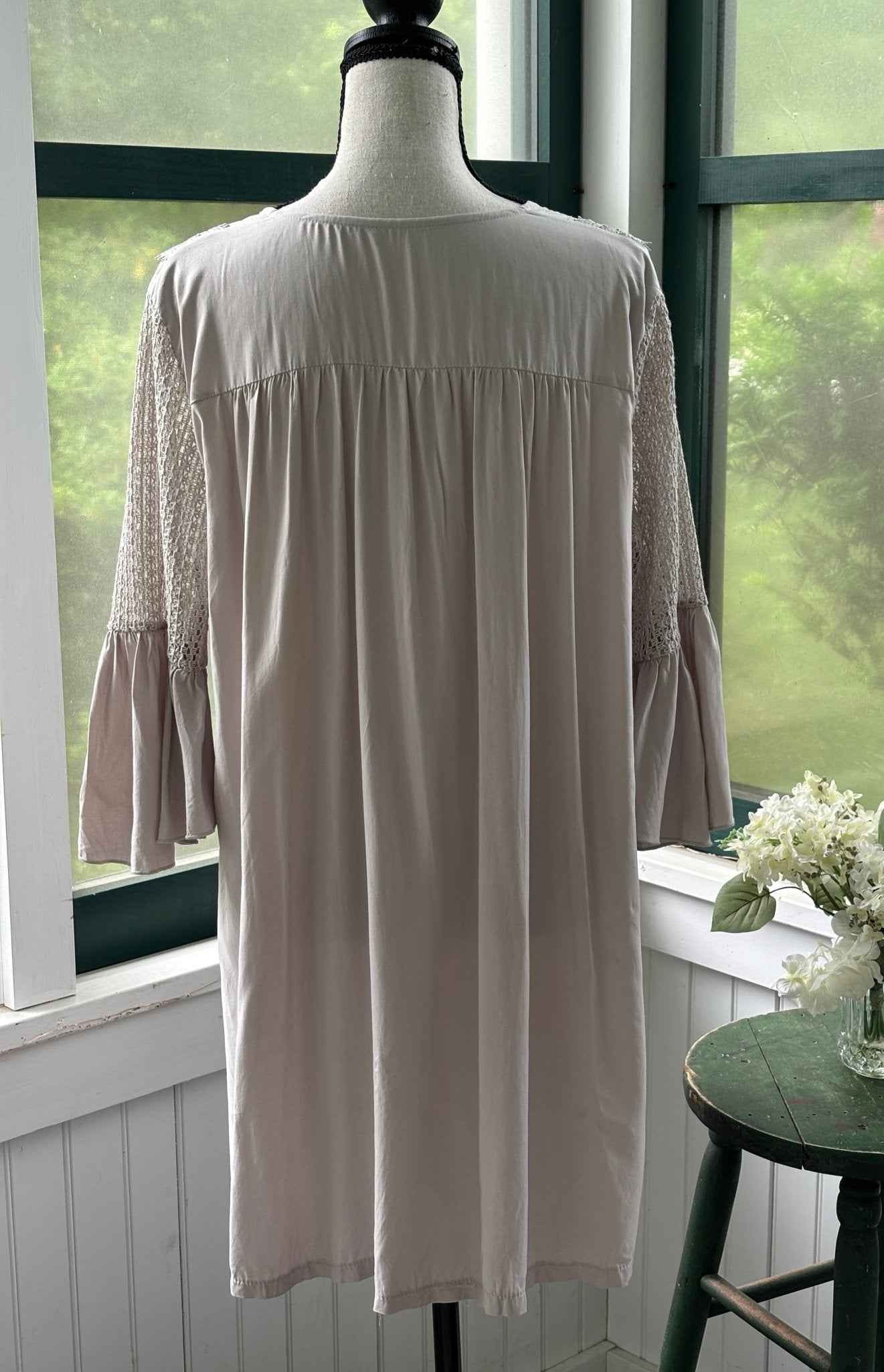 Back view of Cupshe blush lace trim mini dress showing fully gathered silhouette and crochet lace sleeves