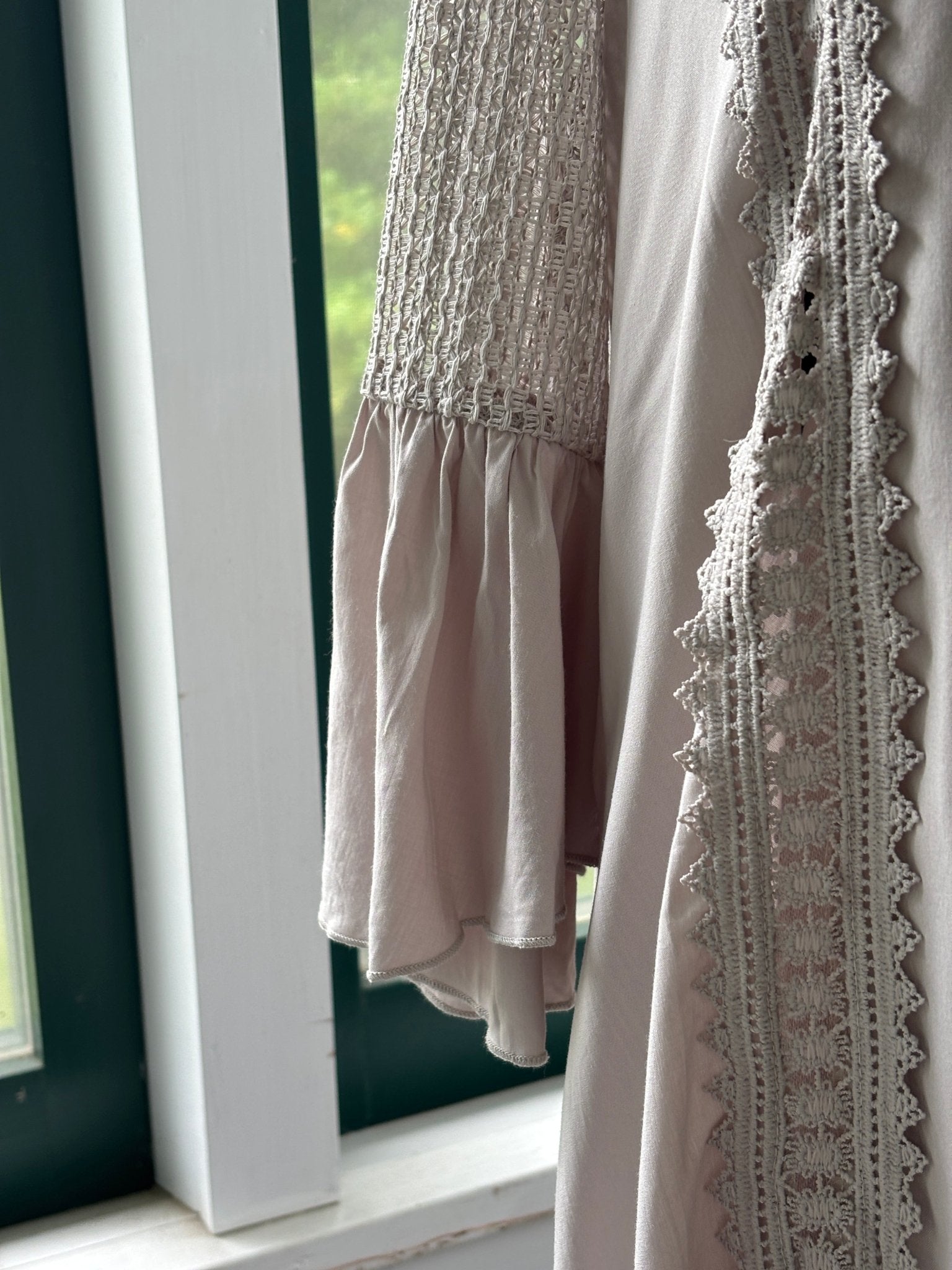 Close-up of open crochet lace sleeve and delicate lace trim detail on Cupshe blush mini dress