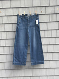 Curve Appeal Heritage Luxe wide leg crop jeans hanging on clothesline, front view with tags