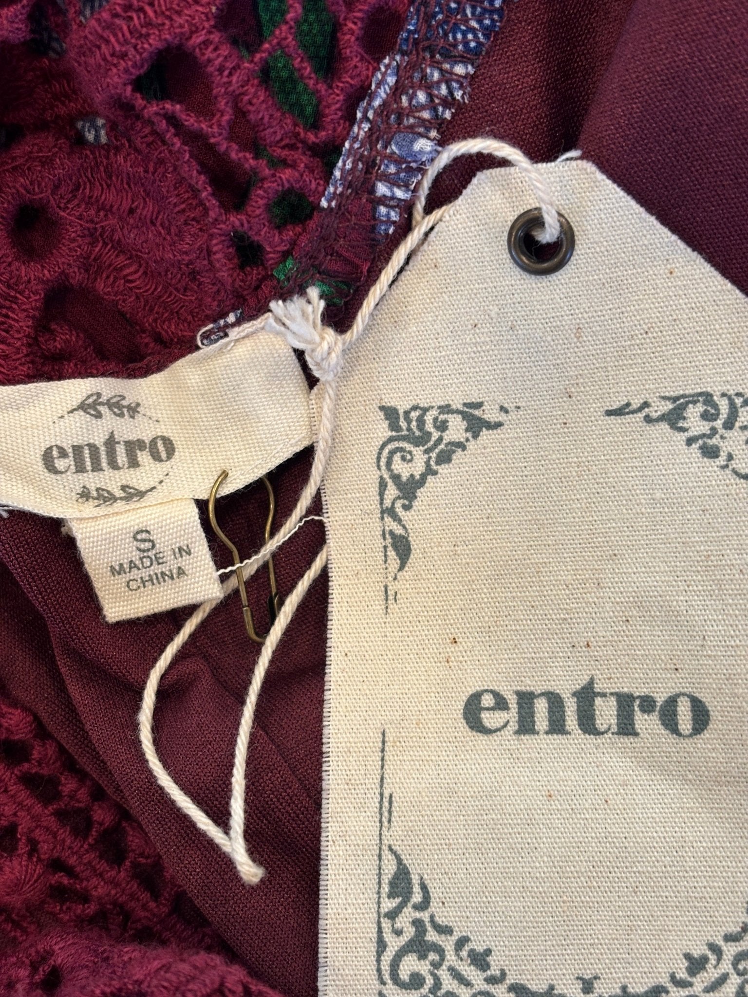 Entro brand label and hang tag showing size Small