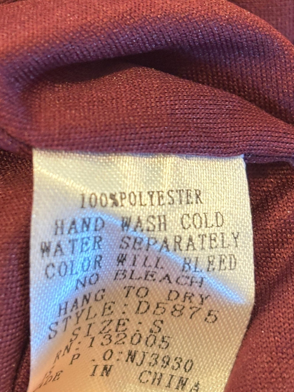 Interior care label — 100% polyester, hand wash cold, hang to dry, Entro style D5875