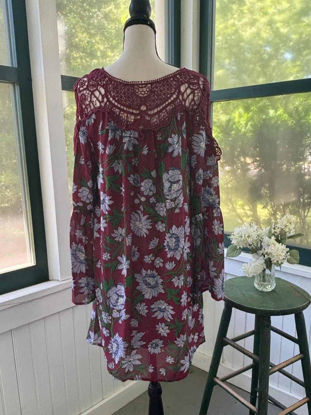 Full back view of Entro burgundy floral mini dress showing crochet yoke across shoulders