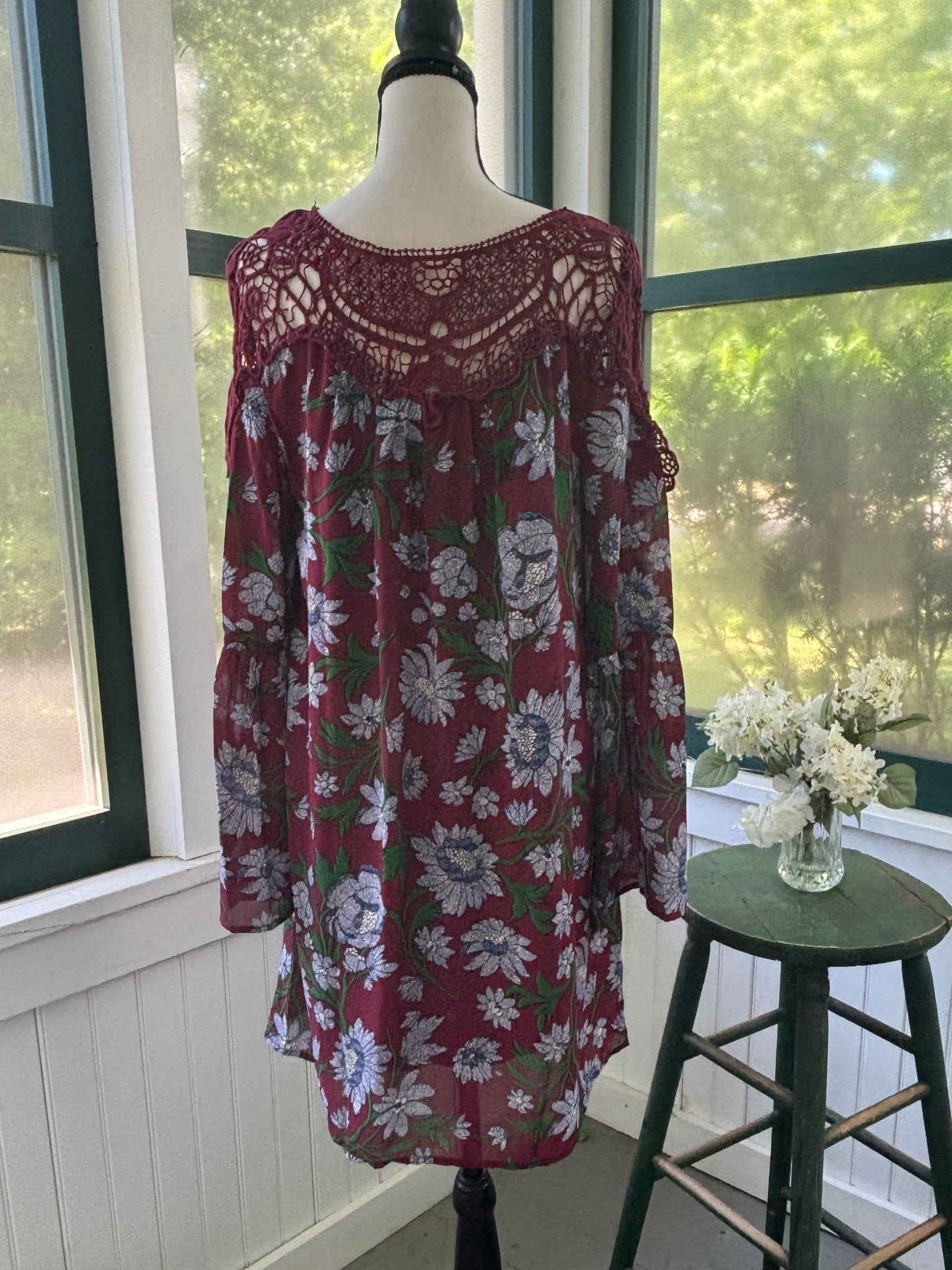 Full back view of Entro burgundy floral mini dress showing crochet yoke across shoulders
