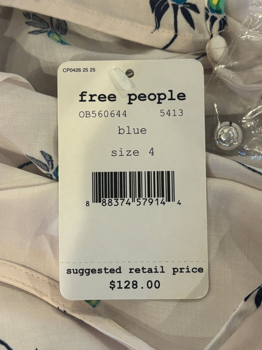 Free People price tag showing size 4 and suggested retail price of $128