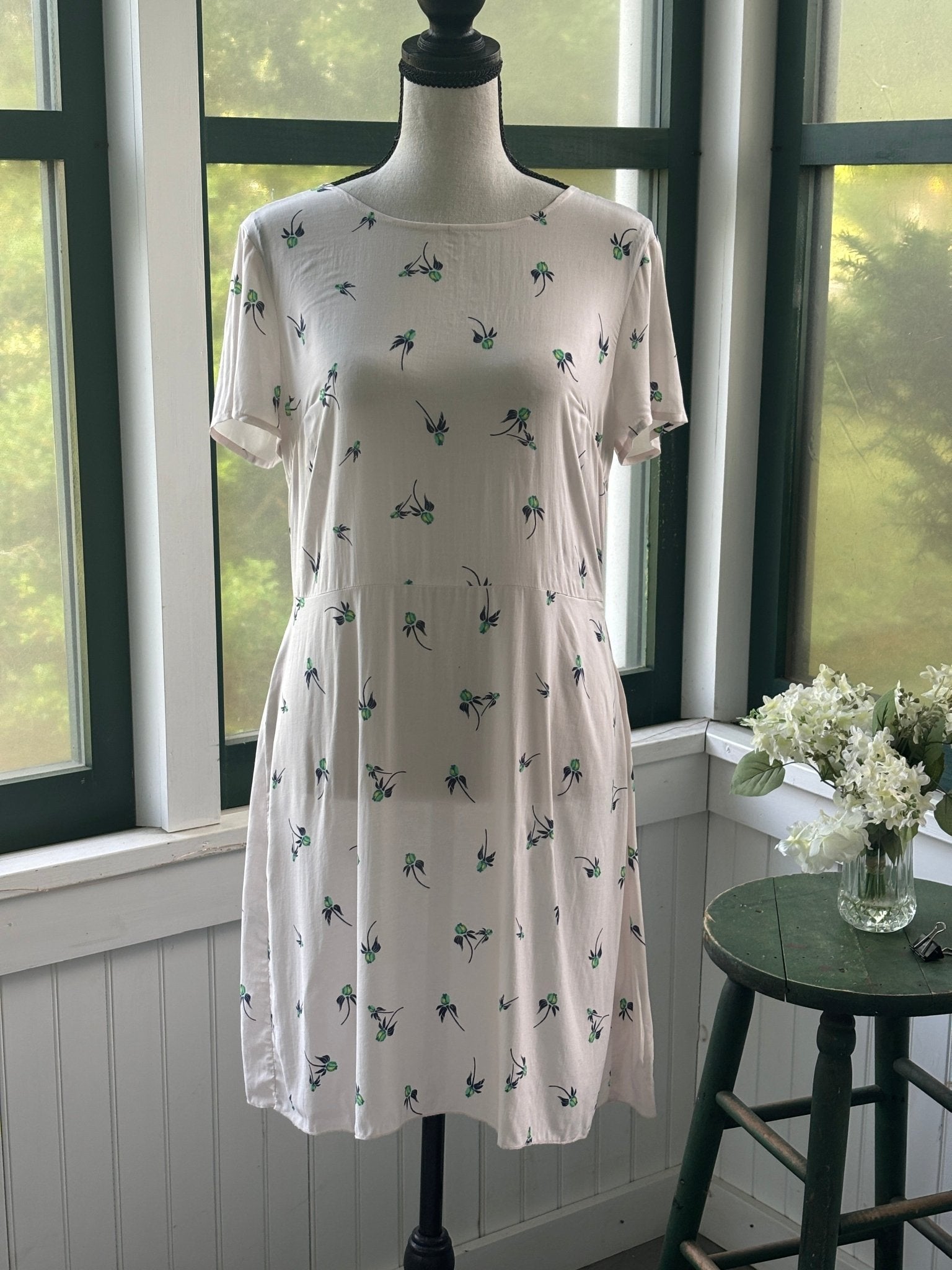 Free People ivory floral mini dress, front view on mannequin