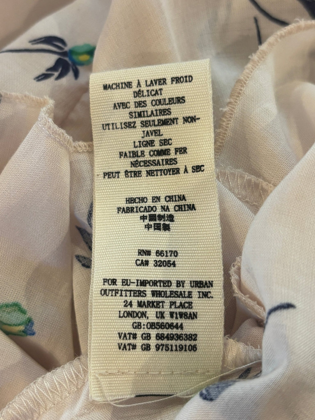 Care instructions and origin label for Free People floral mini dress