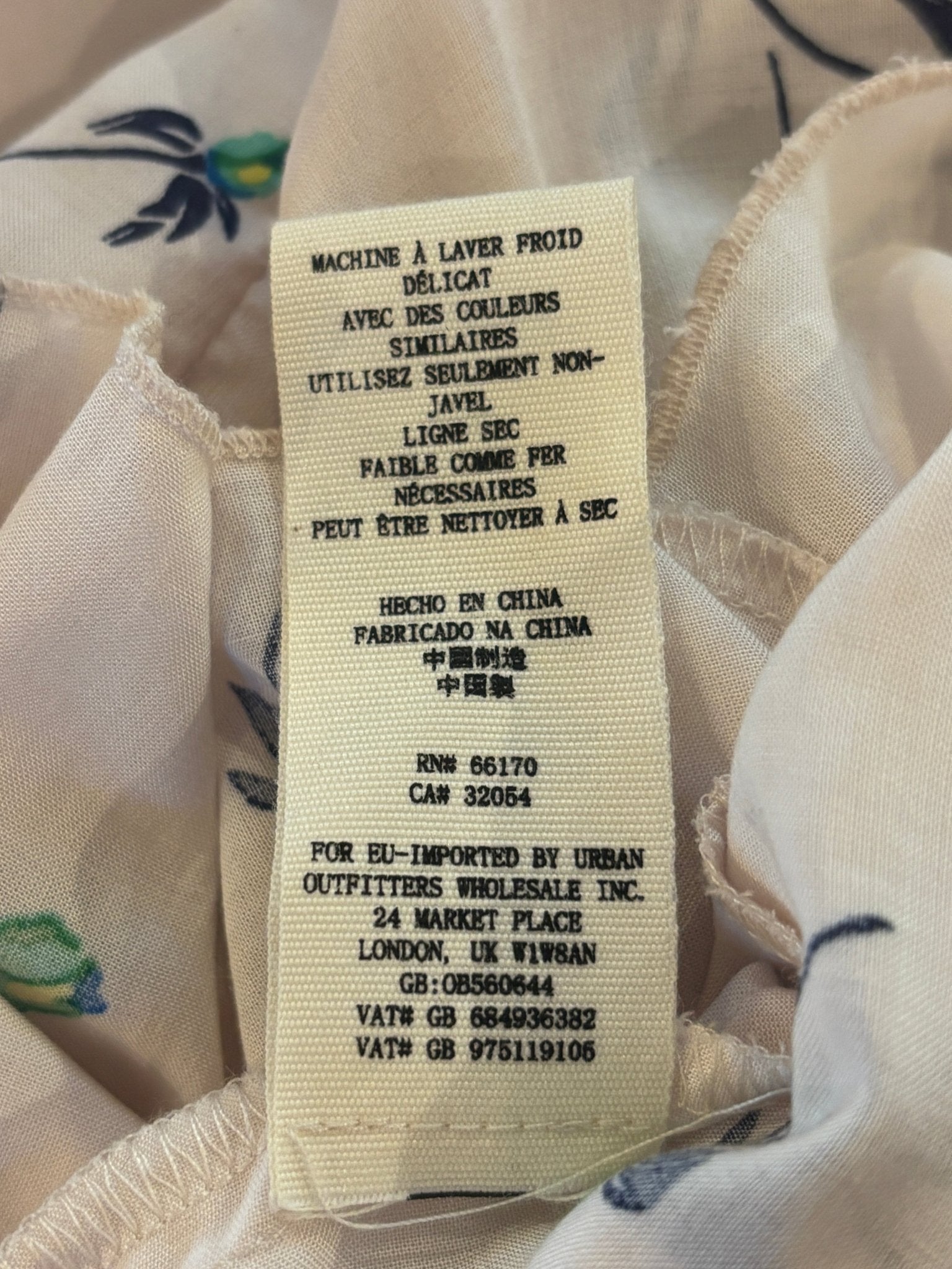 Care instructions and origin label for Free People floral mini dress