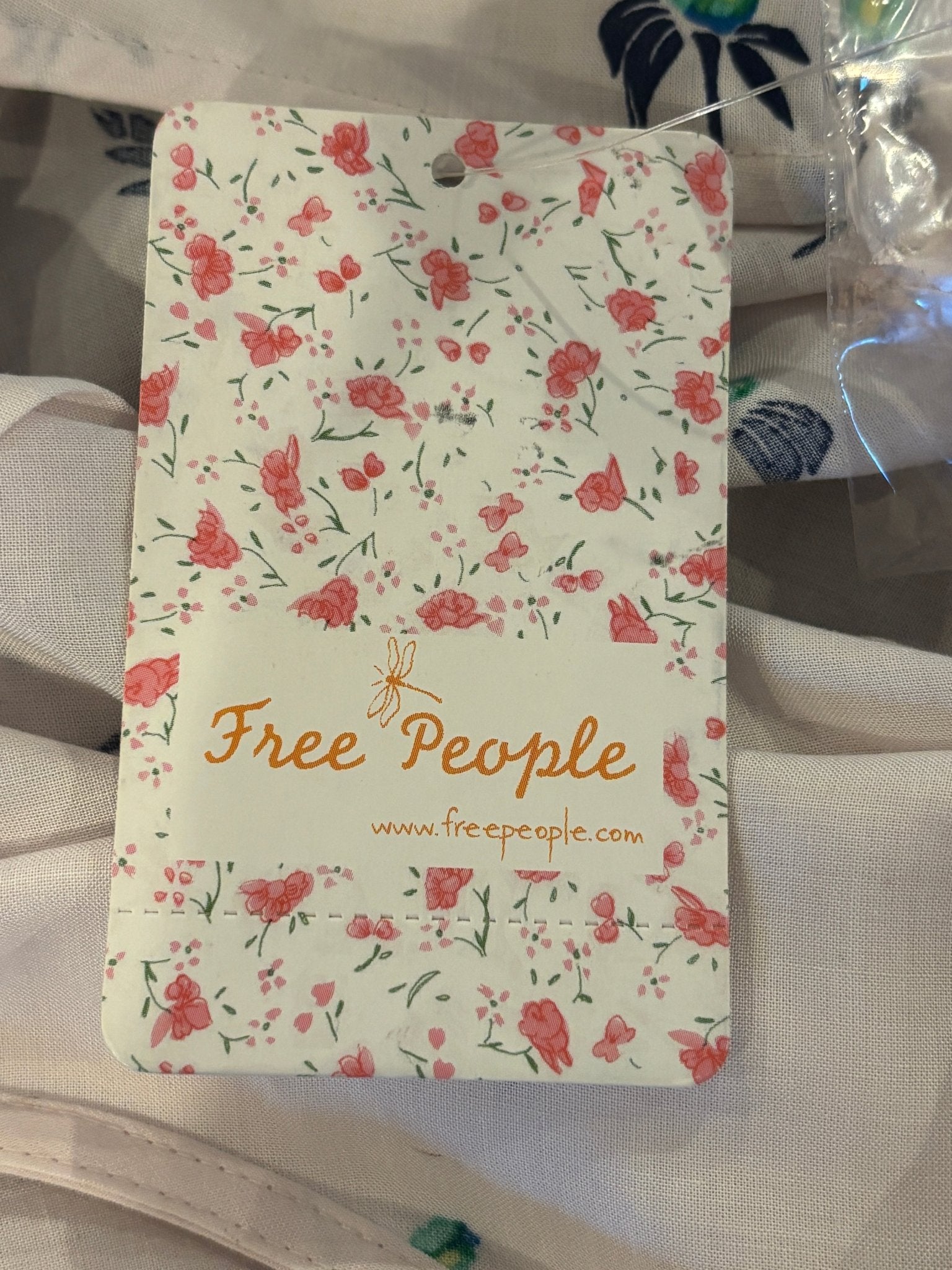 Free People brand tag on floral mini dress