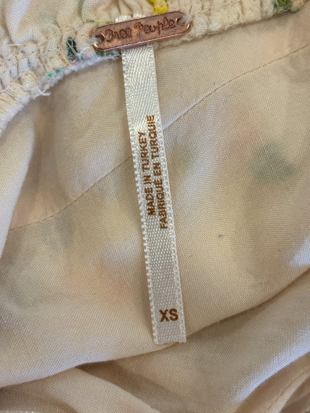 ree People brand label with copper pin hardware showing size XS, Made in Turkey