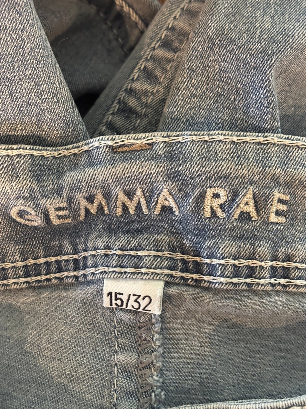 Interior waistband showing embroidered Gemma Rae brand name and size 15/32 tag
