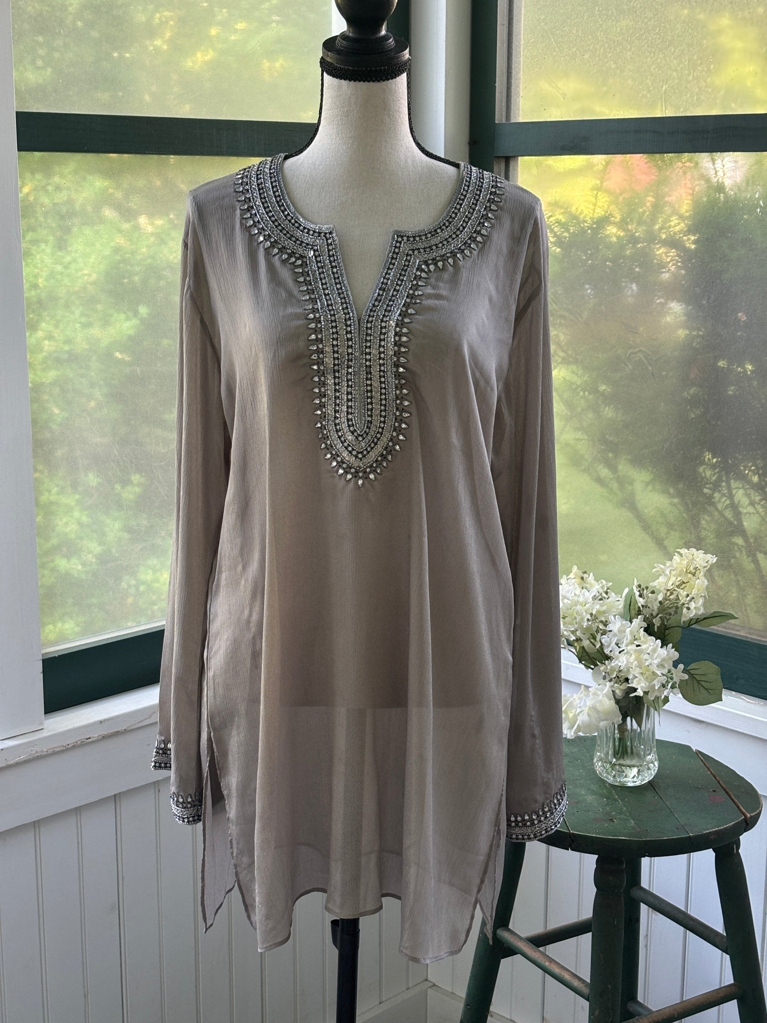 Grids by Sulu Collection taupe beaded tunic dress on mannequin, split V-neckline with intricate rhinestone and seed bead medallion bib detail